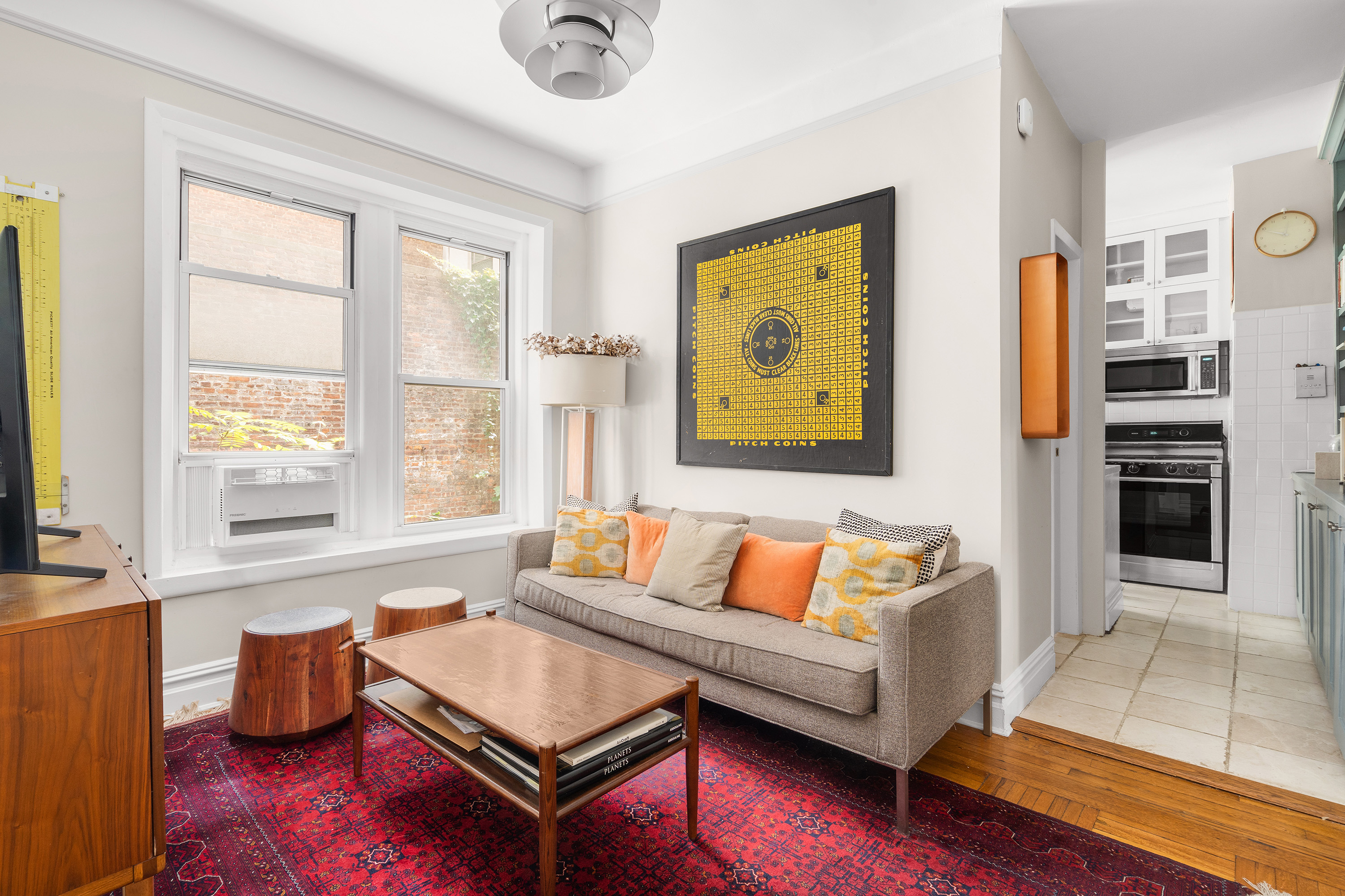 a living room with furniture and a window