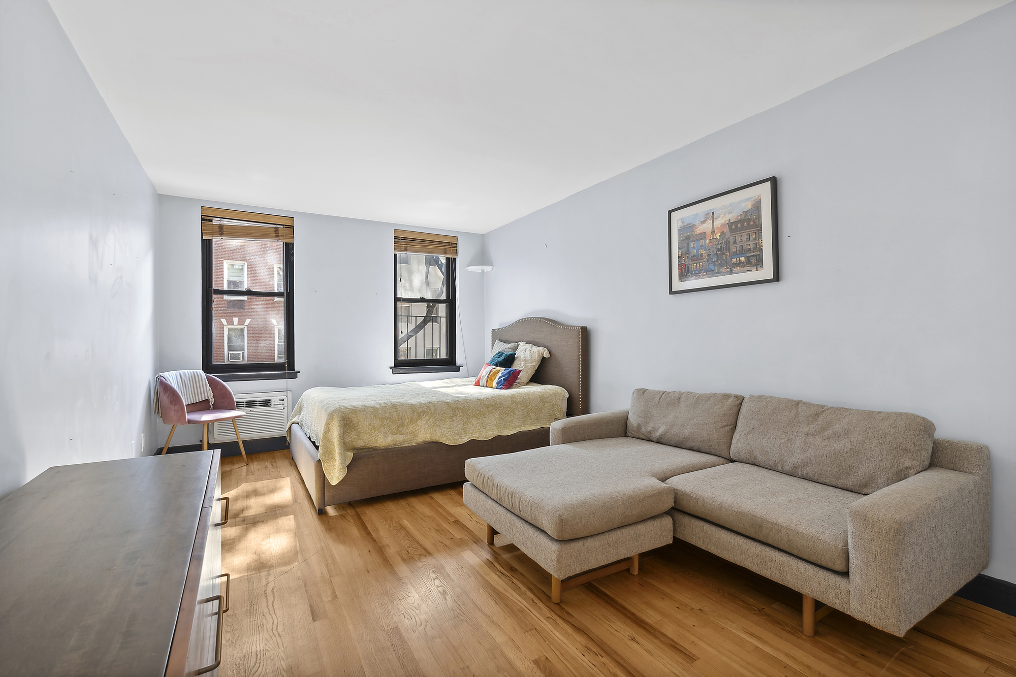 a bedroom with furniture and a window