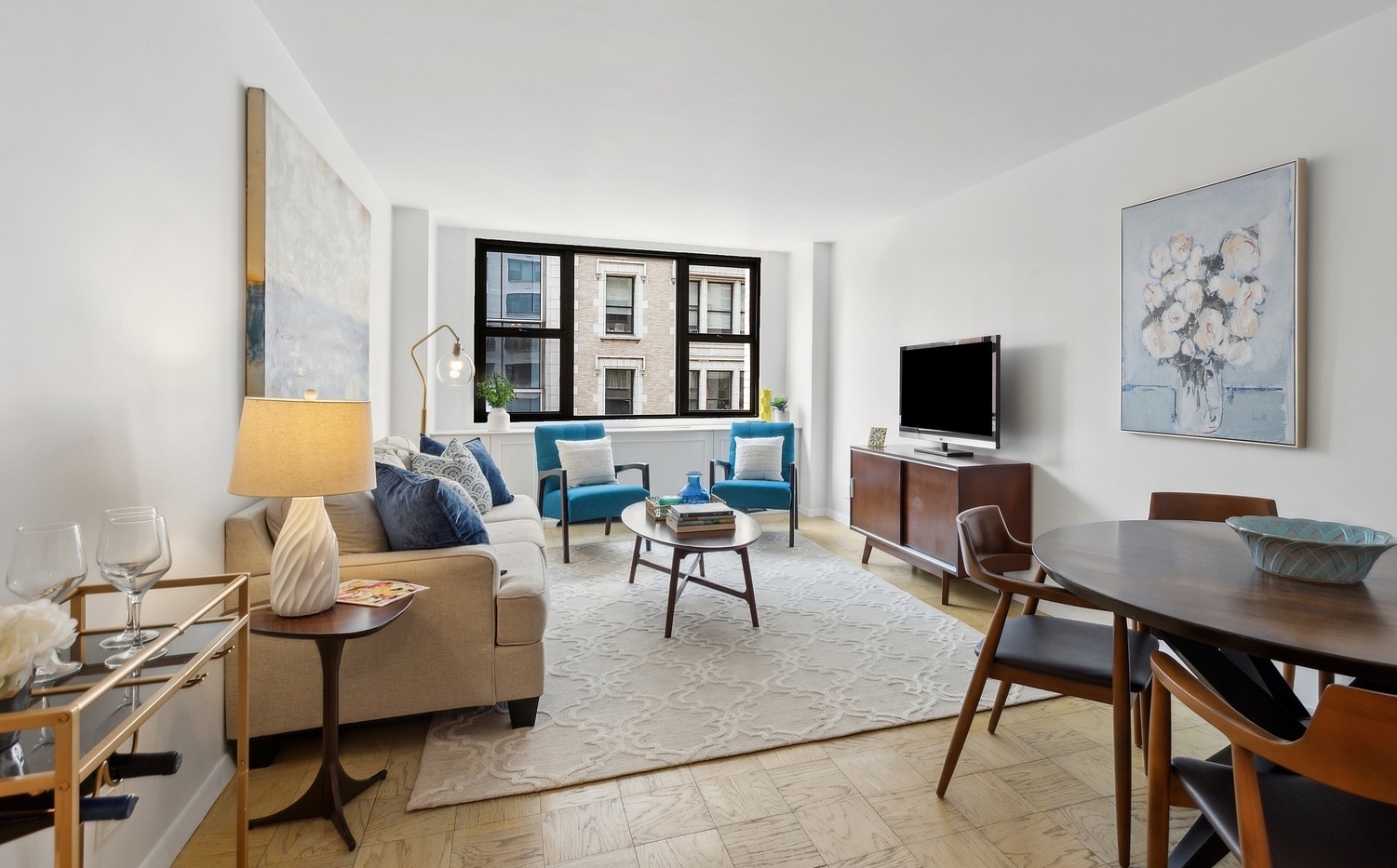 a living room with furniture and a flat screen tv