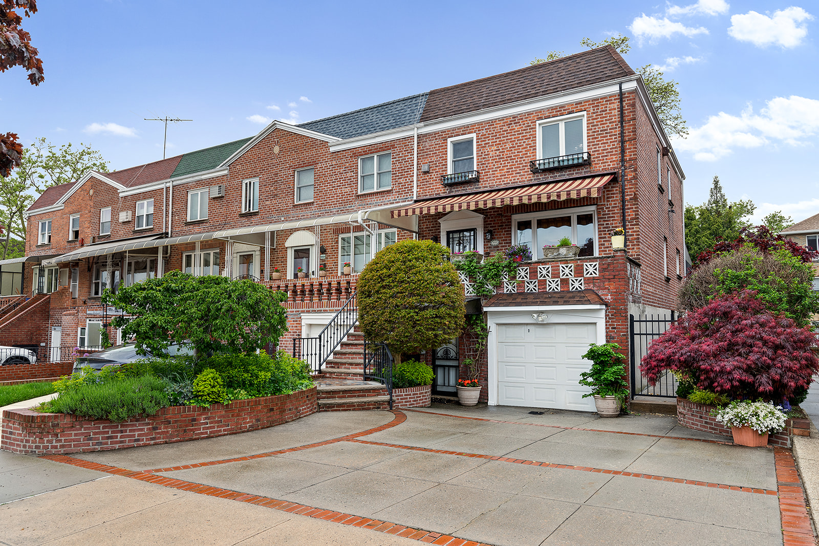 a front view of a house with garden