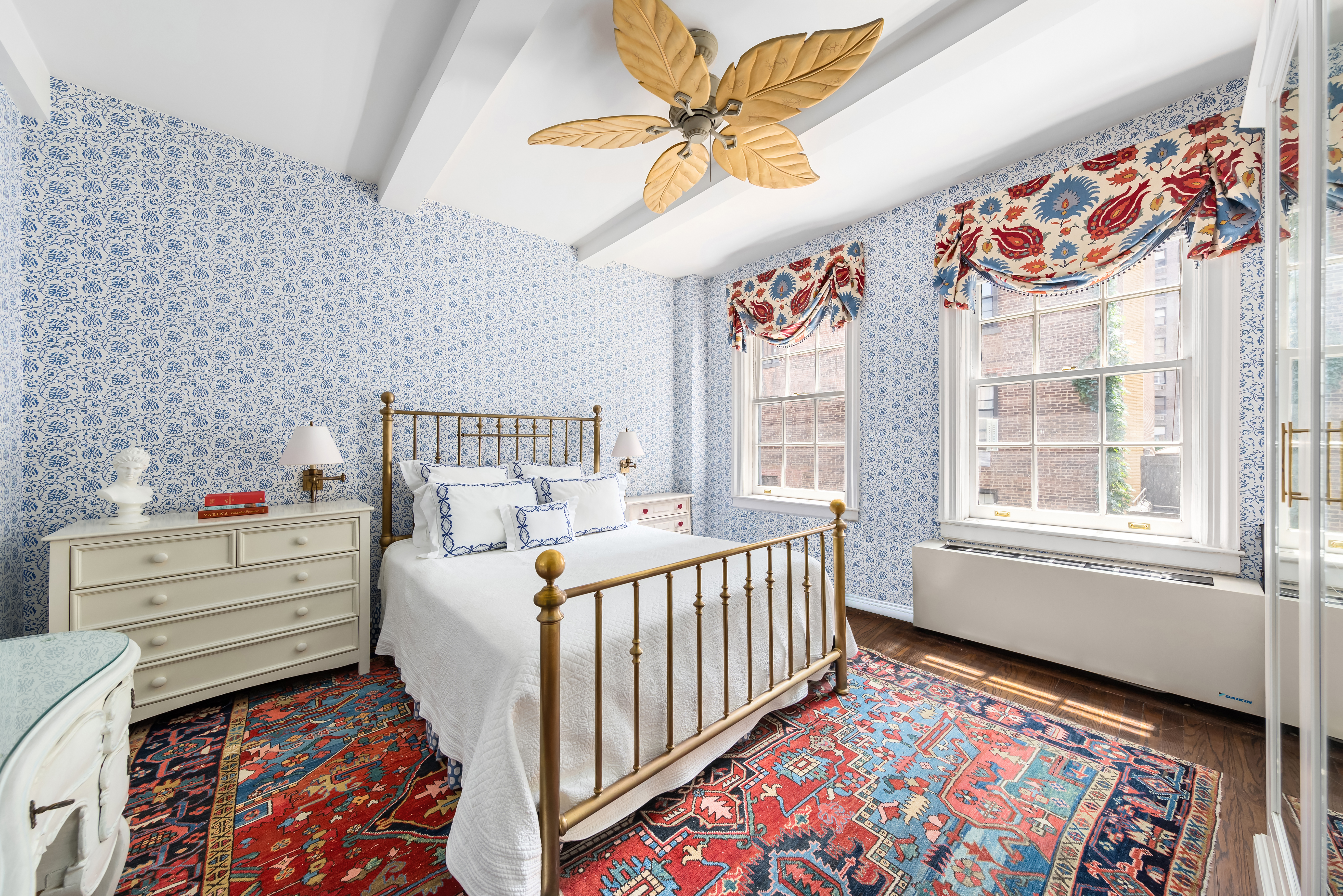 a bedroom with furniture and a window