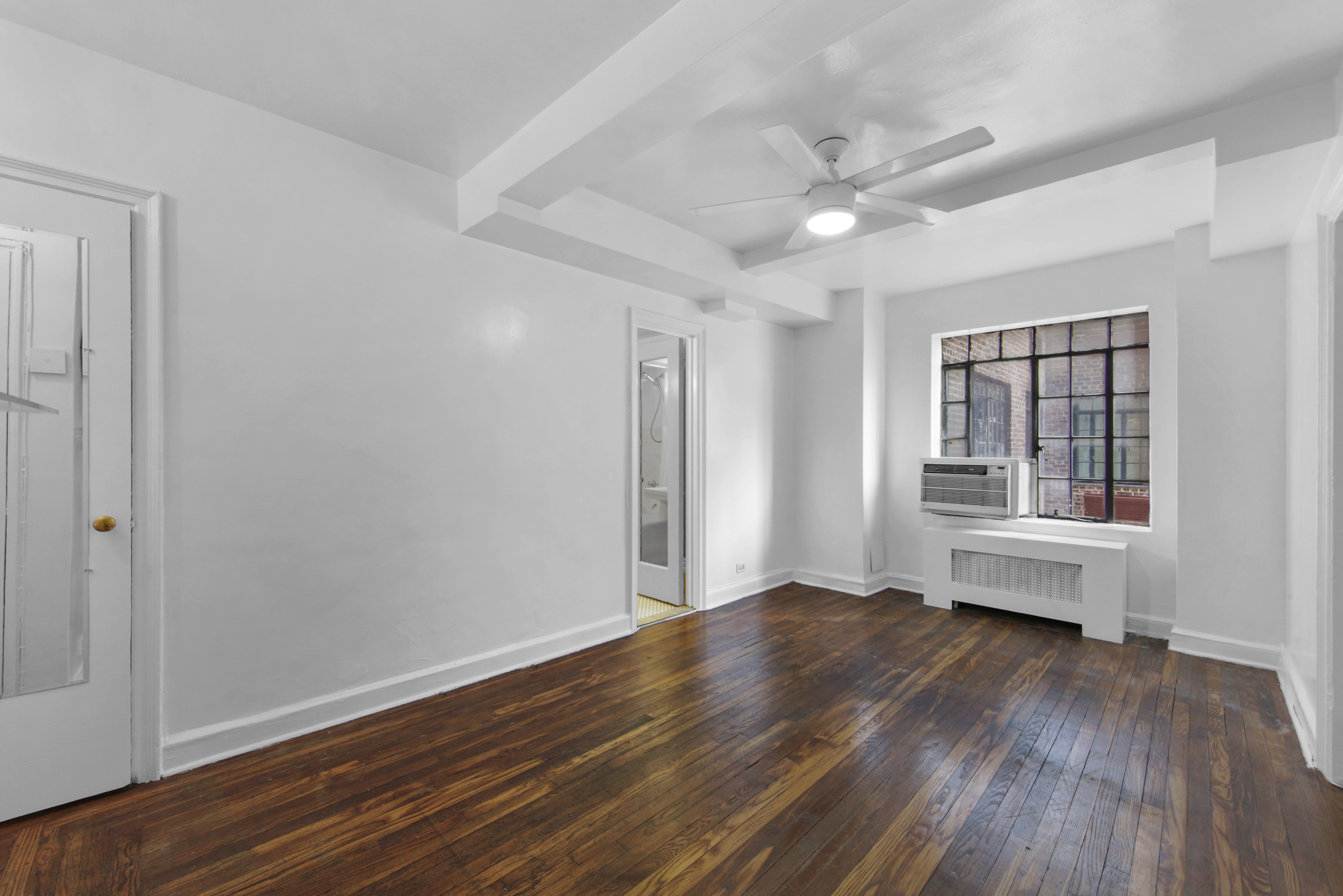 a view of livingroom with hardwood floor and window