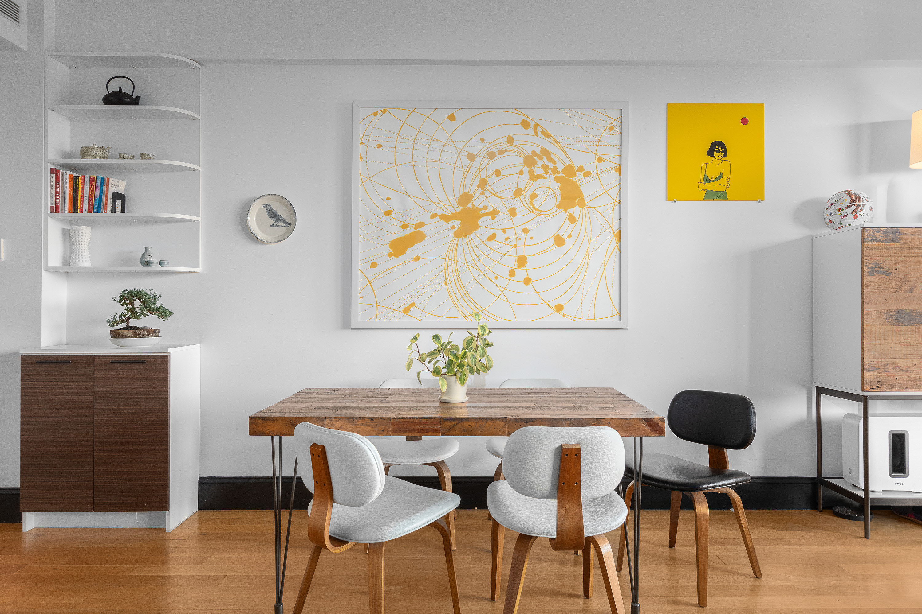 a view of a dining room with furniture and wooden floor