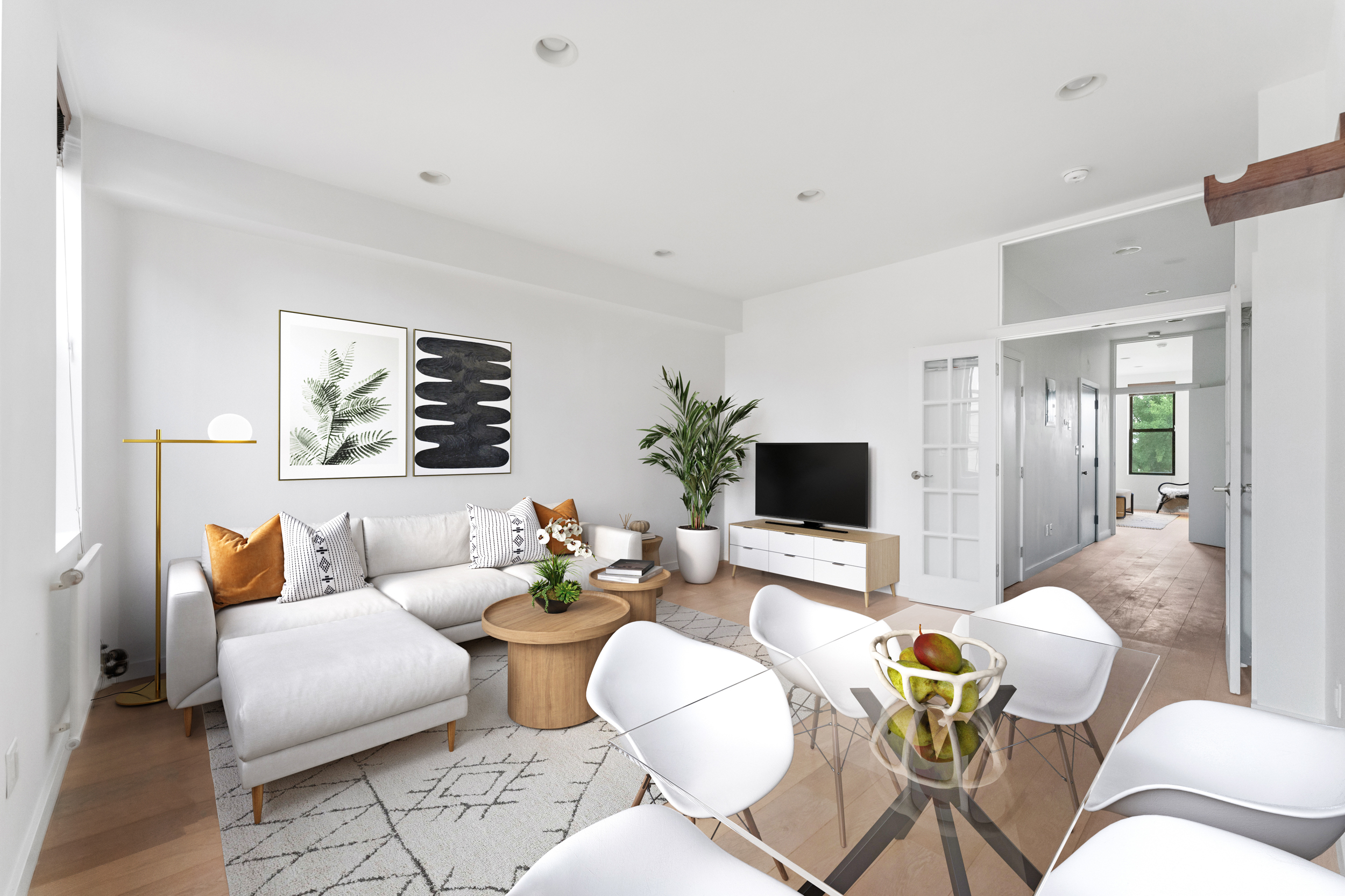 a living room with furniture and a flat screen tv