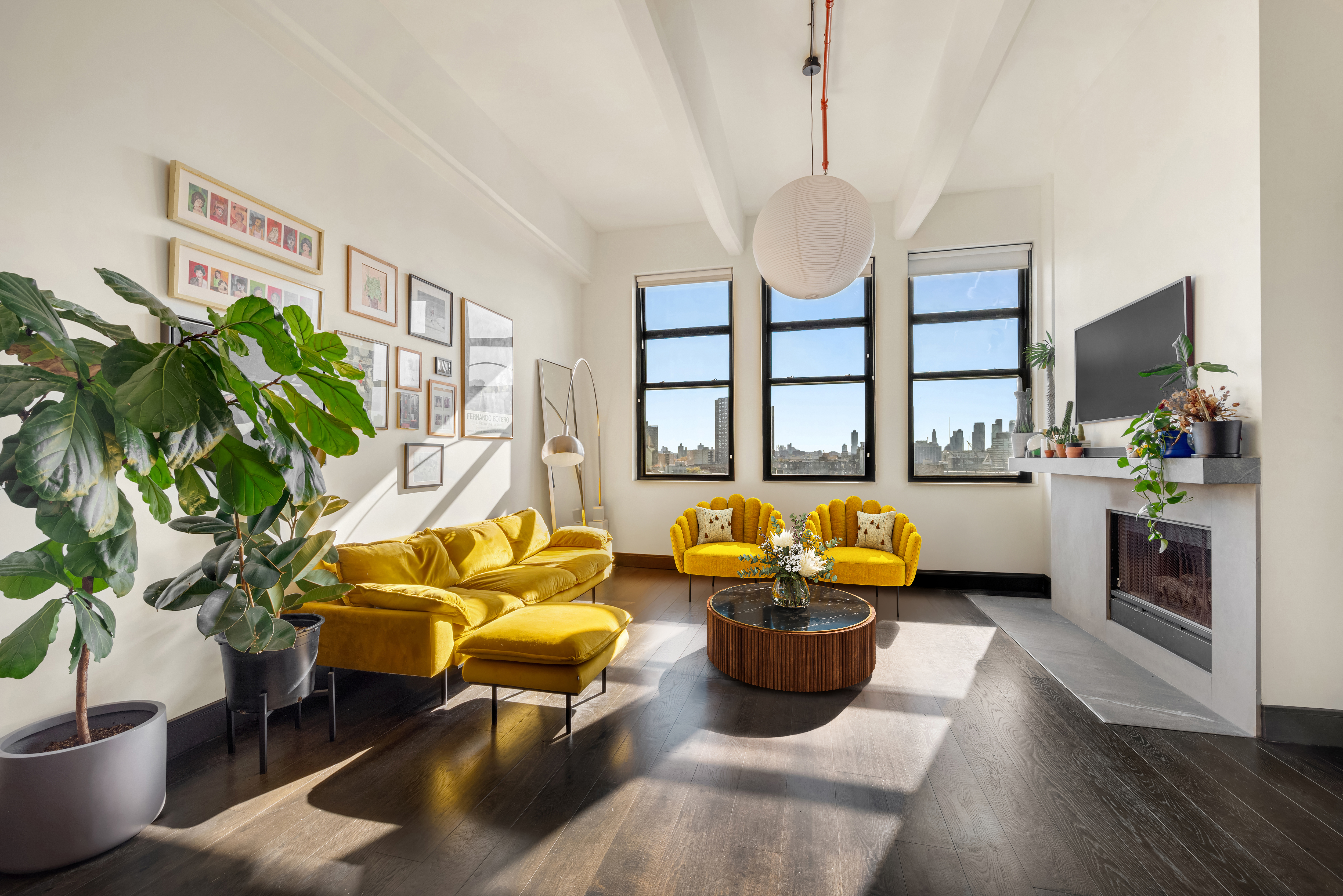 a living room with patio furniture and a large window