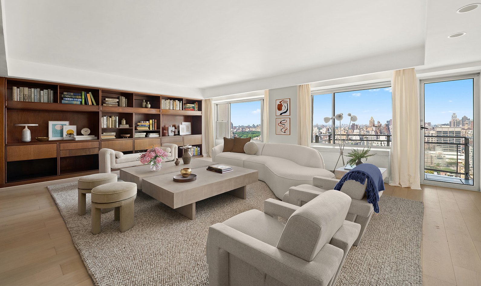 a living room with furniture and a book shelf