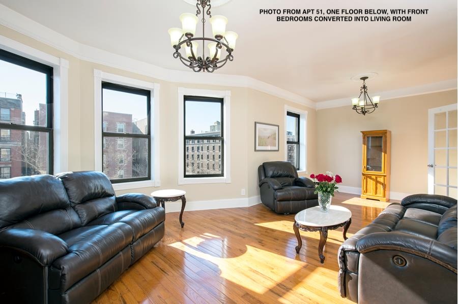 a living room with furniture or couch and a window