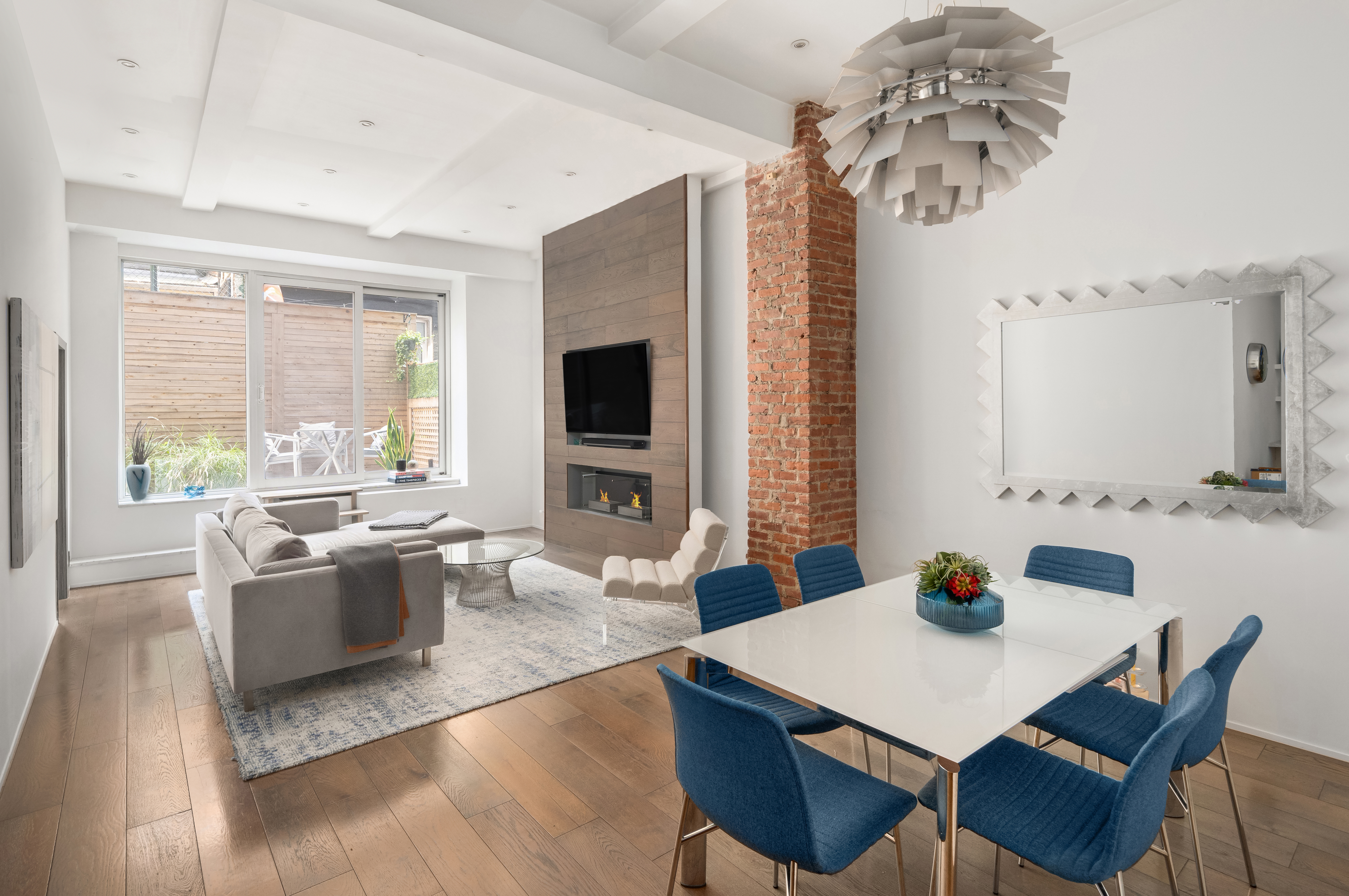 a view of a dining room with furniture window and wooden floor