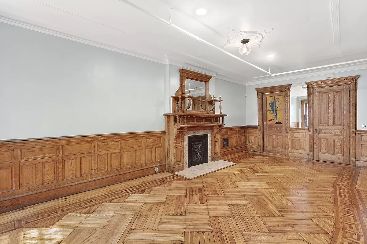 a view of an empty room with a kitchen