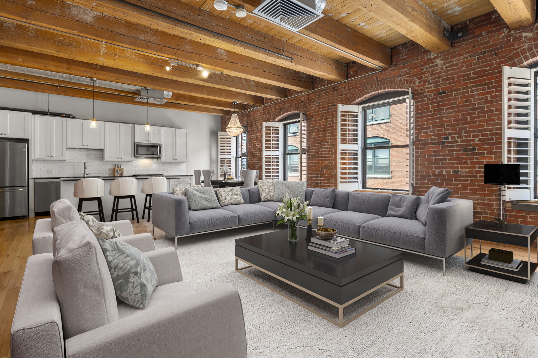 a living room with furniture kitchen view and a large window