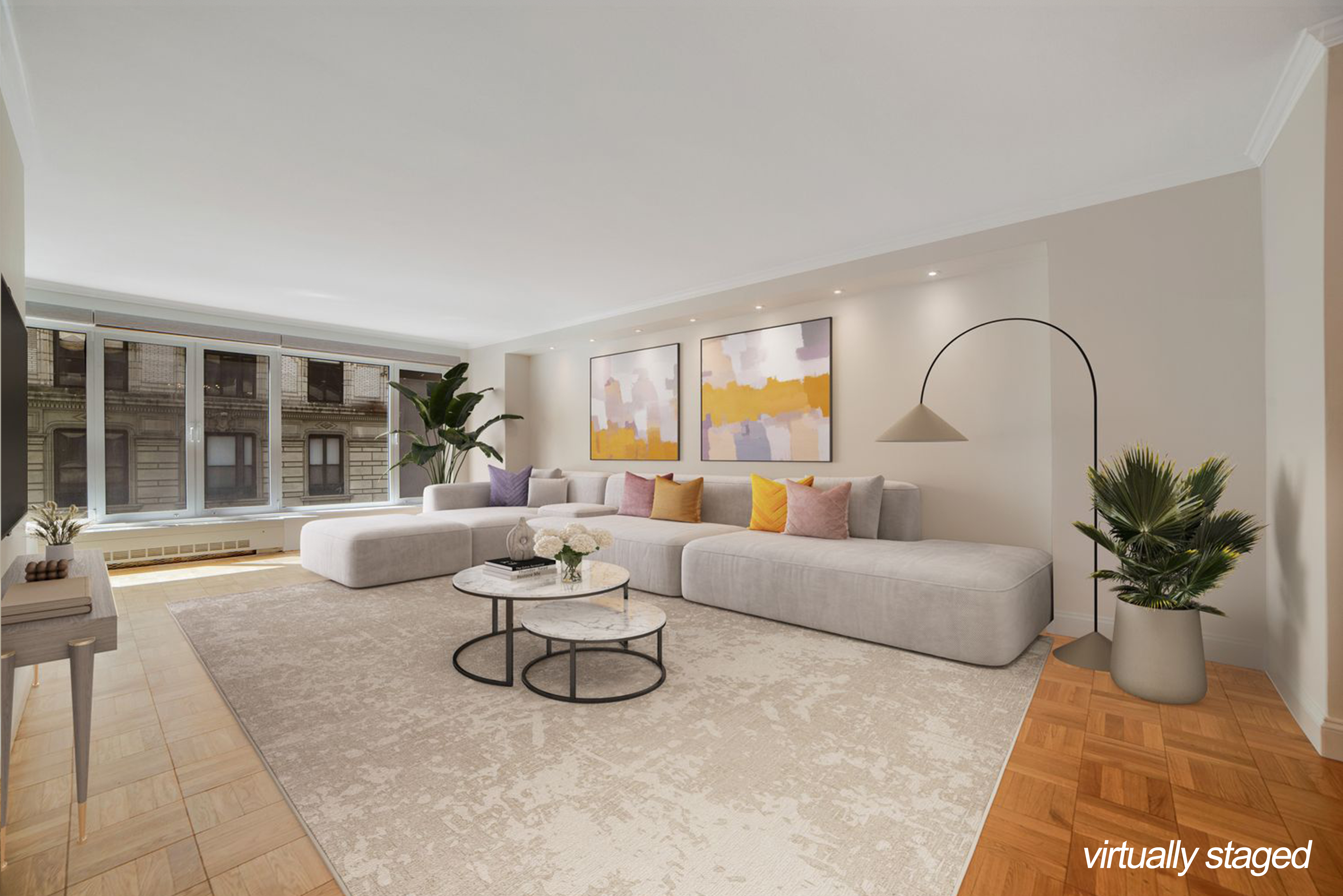 a living room with furniture and a potted plant