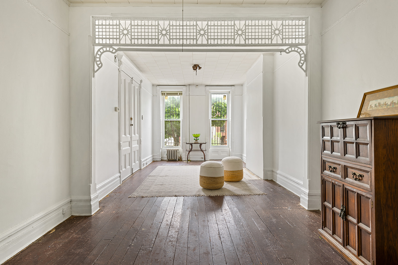 a view of an entryway with wooden floor