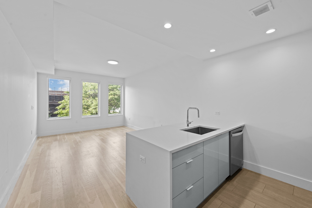 a kitchen with a sink and window