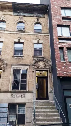 a building with a clock on the wall