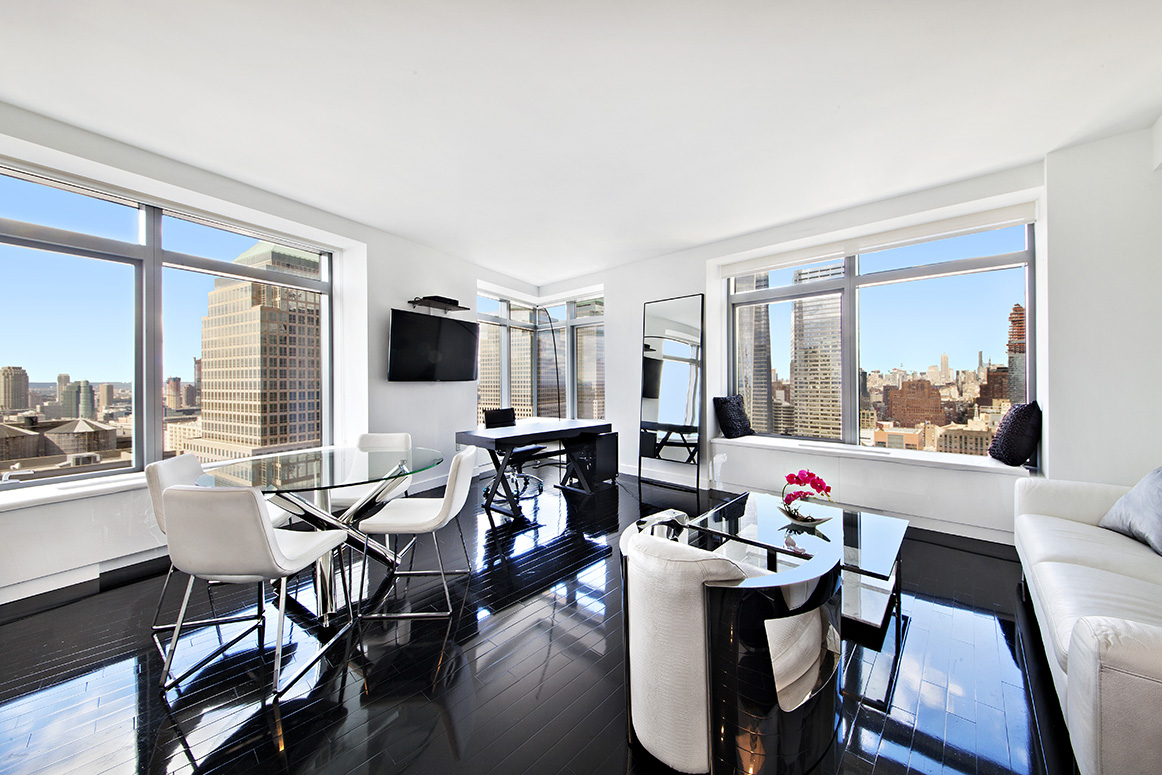 a view of a dining room with furniture window and outside view