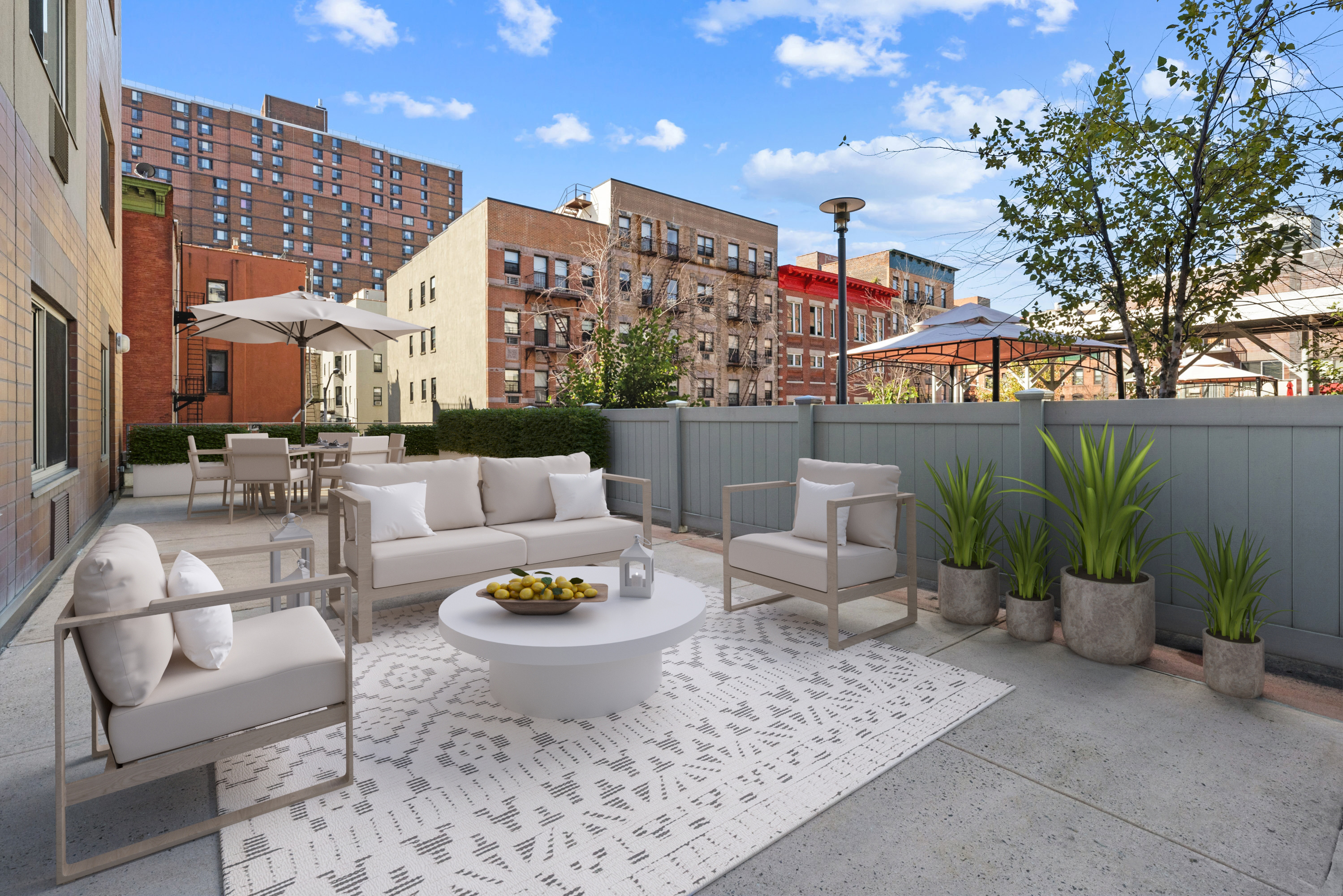 a view of a patio with couches and potted plants