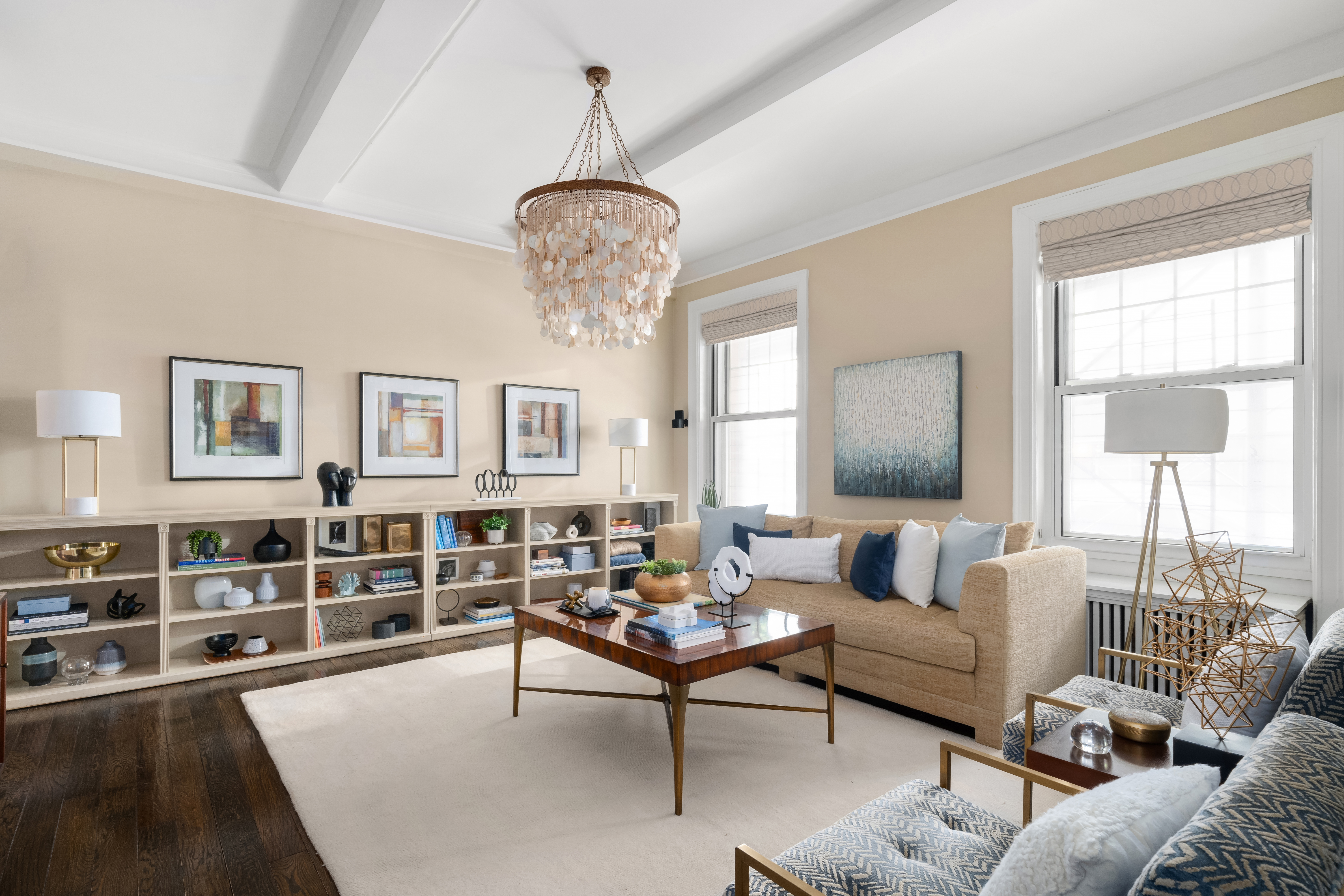 a living room with furniture or chandelier and a window