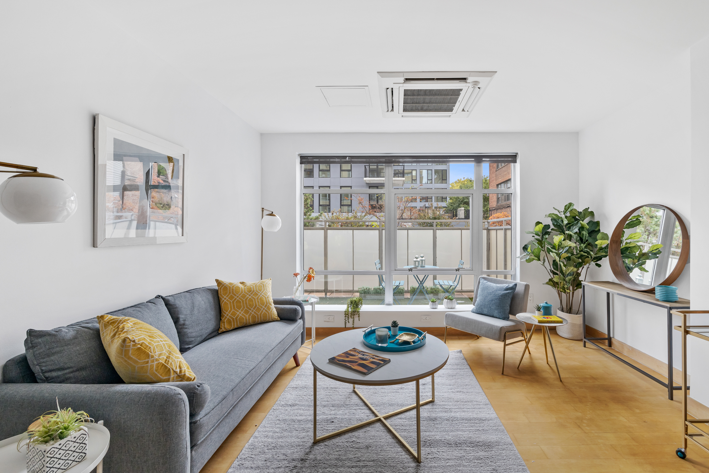 a living room with furniture and a large window