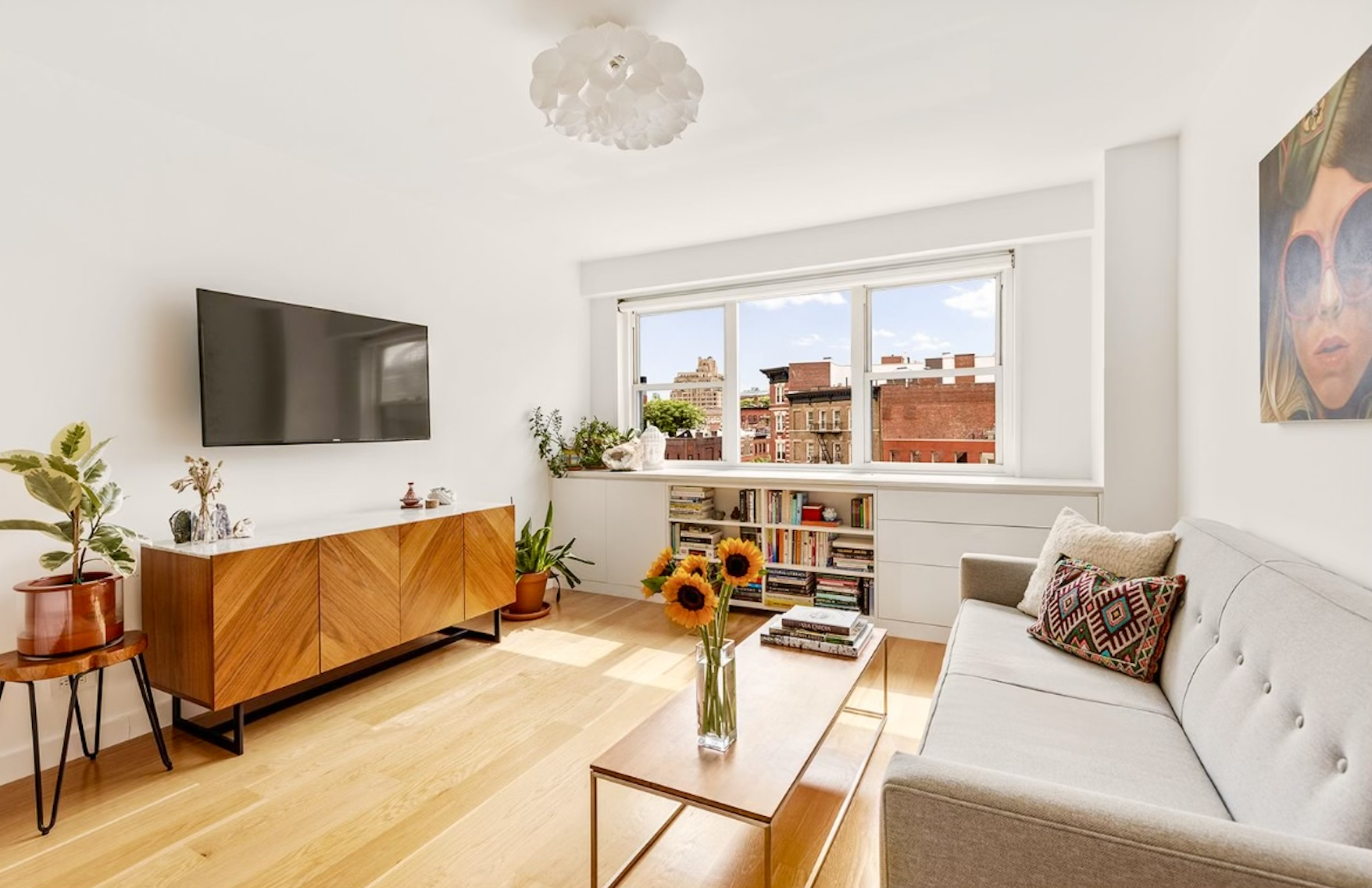 a living room with furniture and a flat screen tv