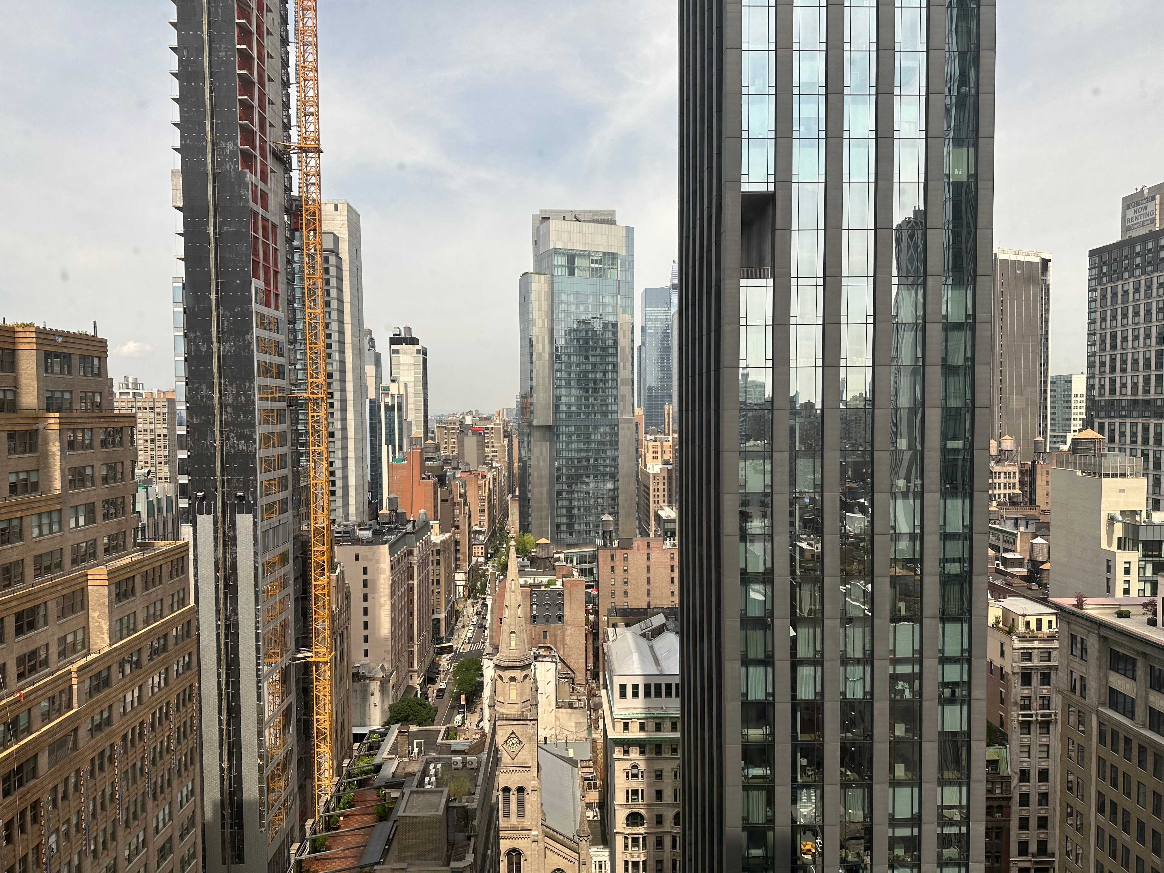 a view of a city with tall buildings