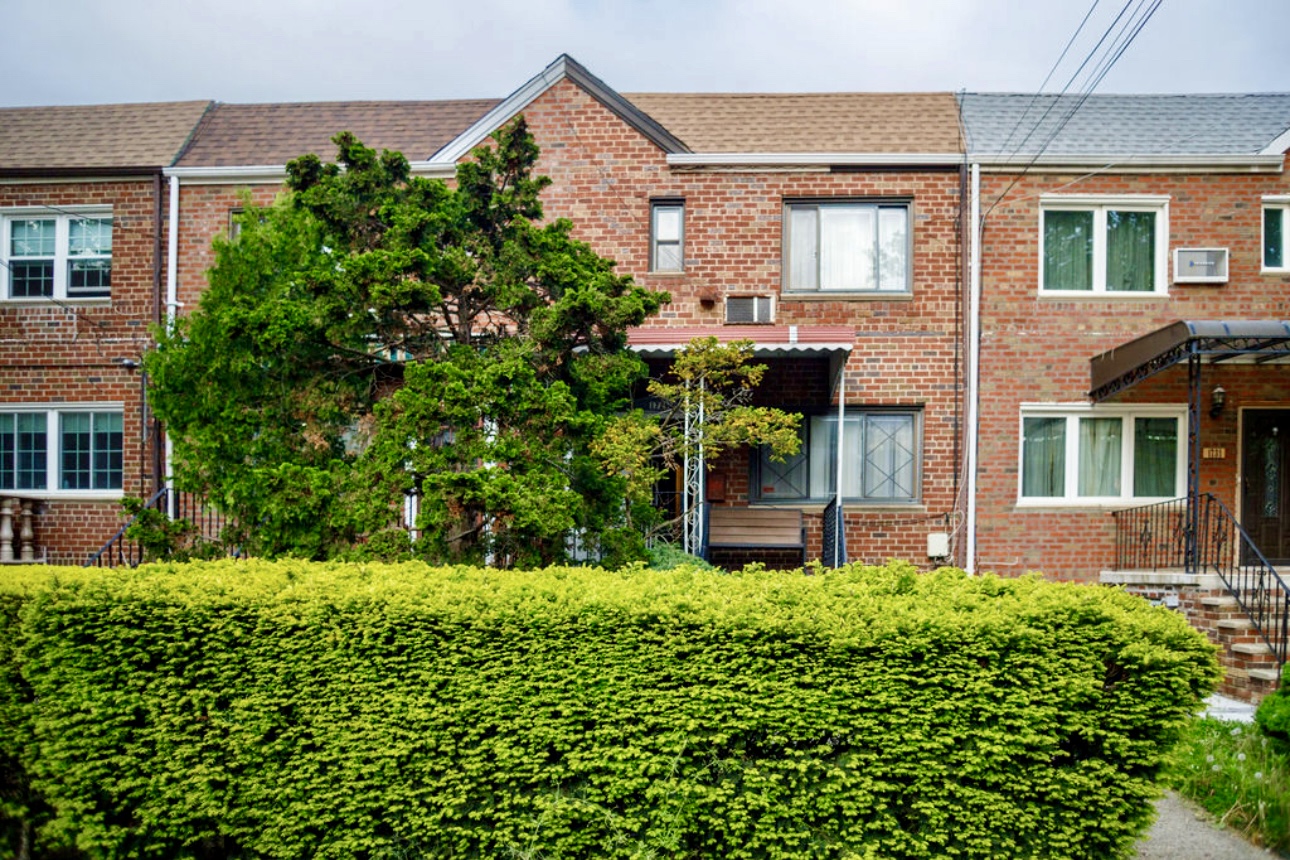 front view of a house with a yard