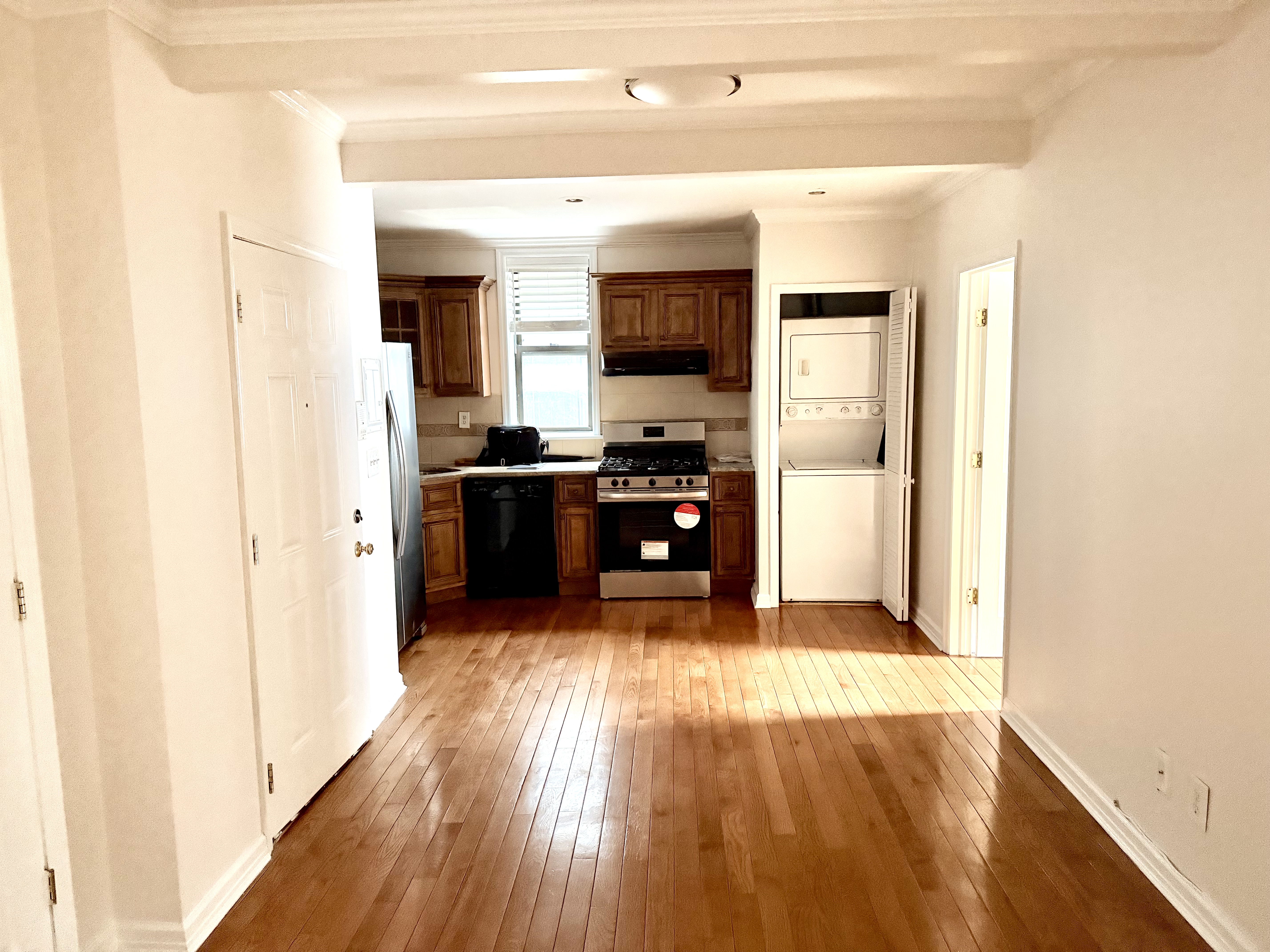 a kitchen with stainless steel appliances granite countertop a stove and a refrigerator