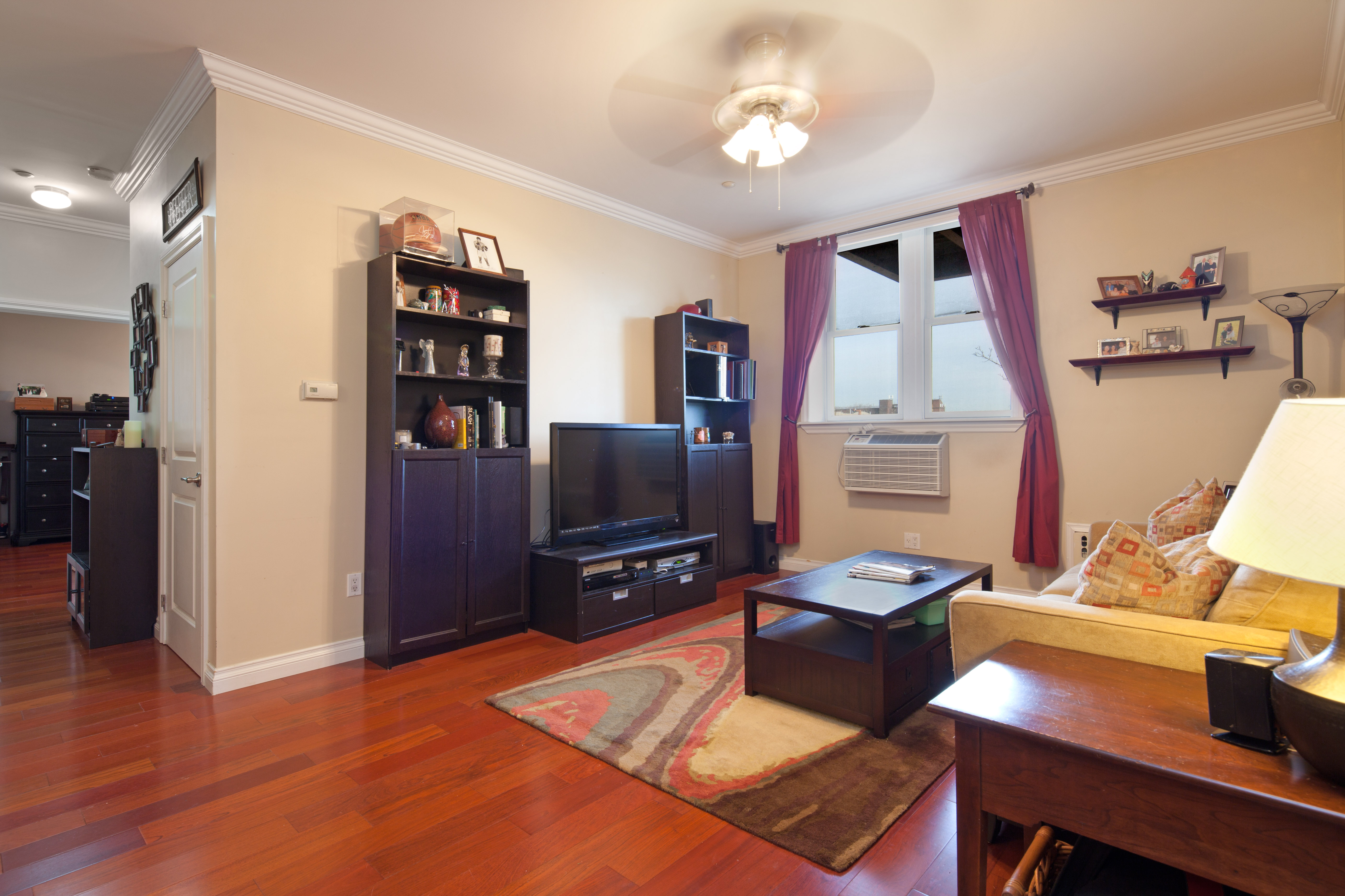 a view of a workspace with furniture and wooden floor