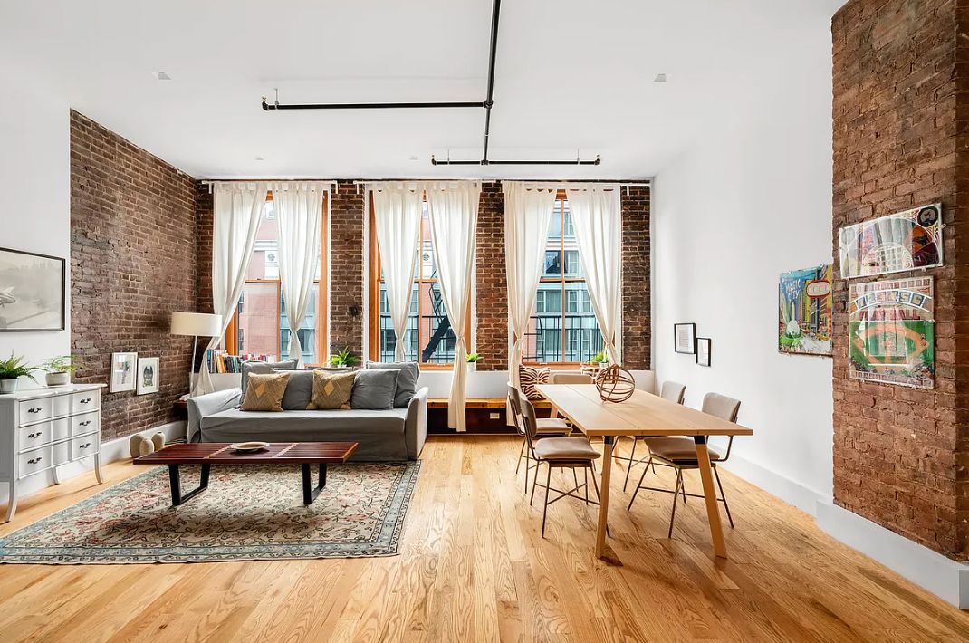 a living room with furniture and a table