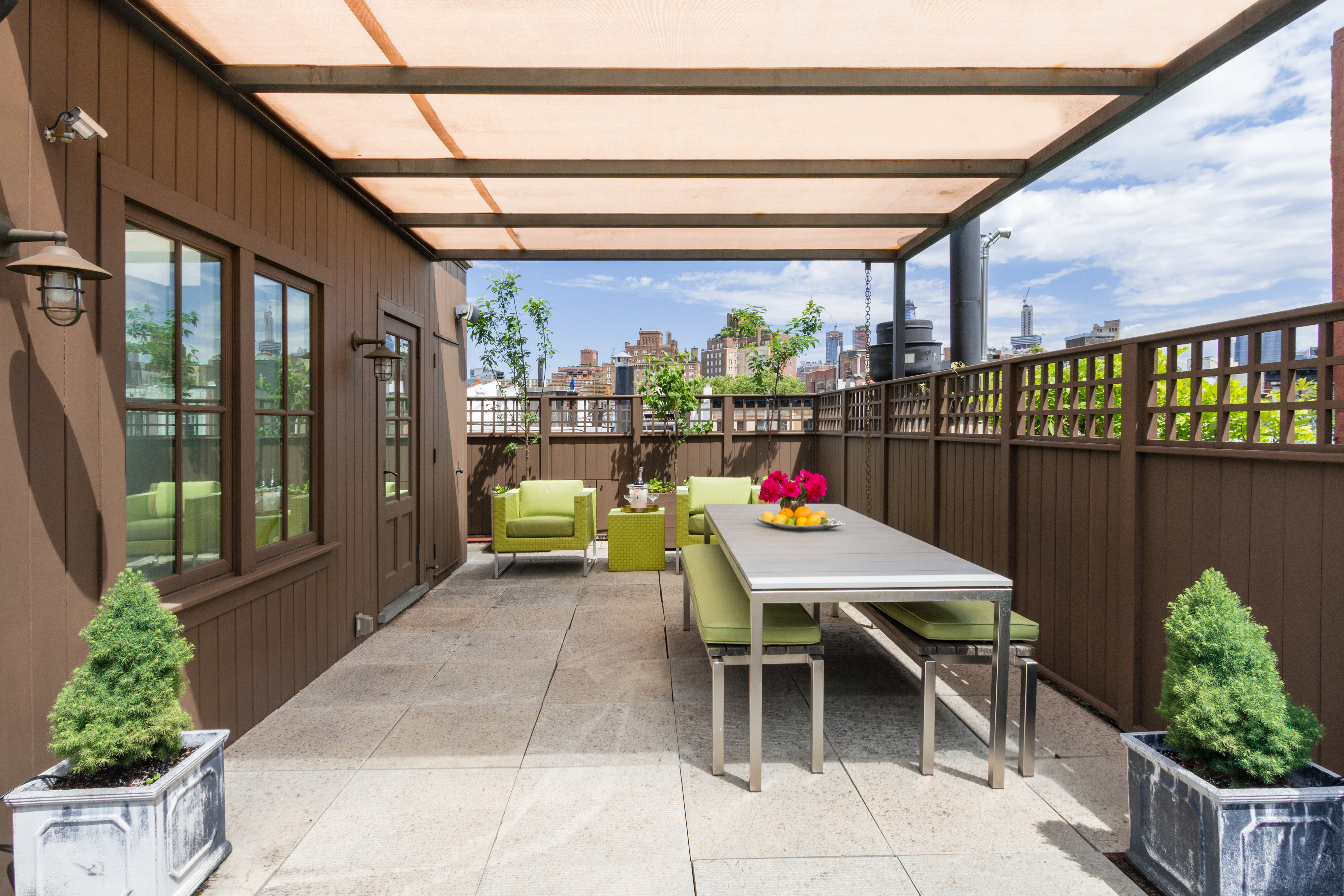 a outdoor dining space with furniture and outdoor view