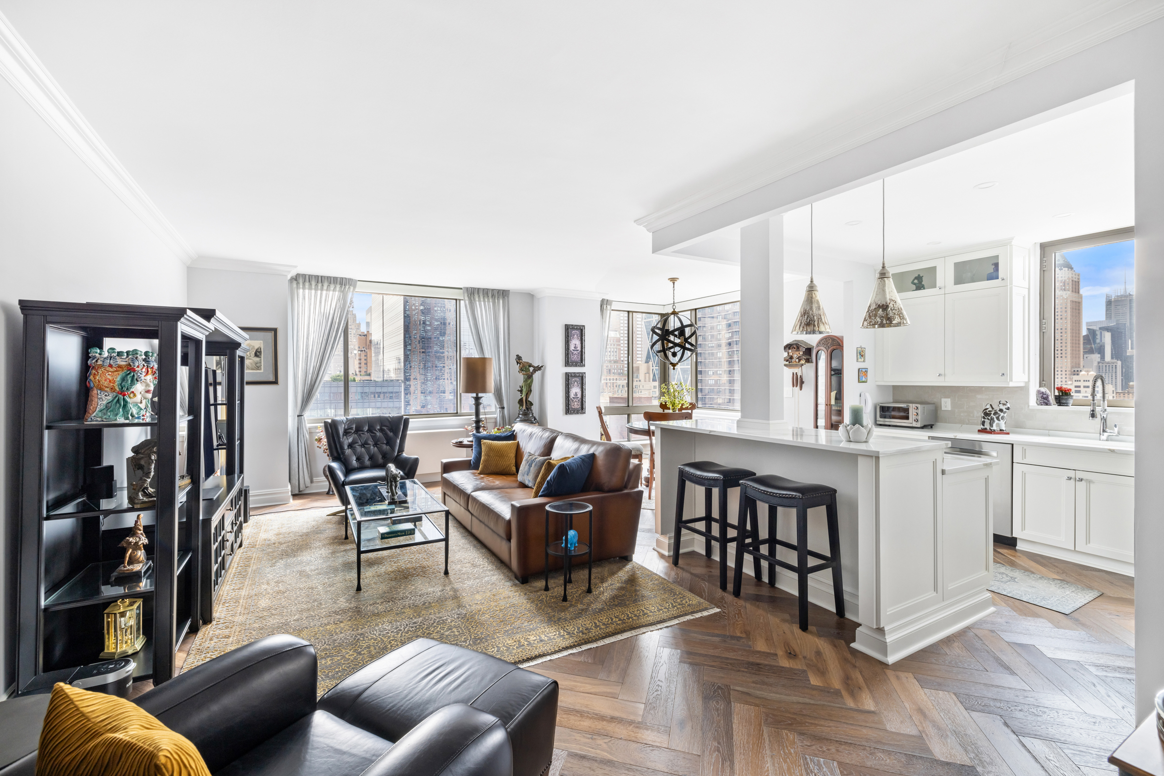 a living room with furniture a dining table and chairs