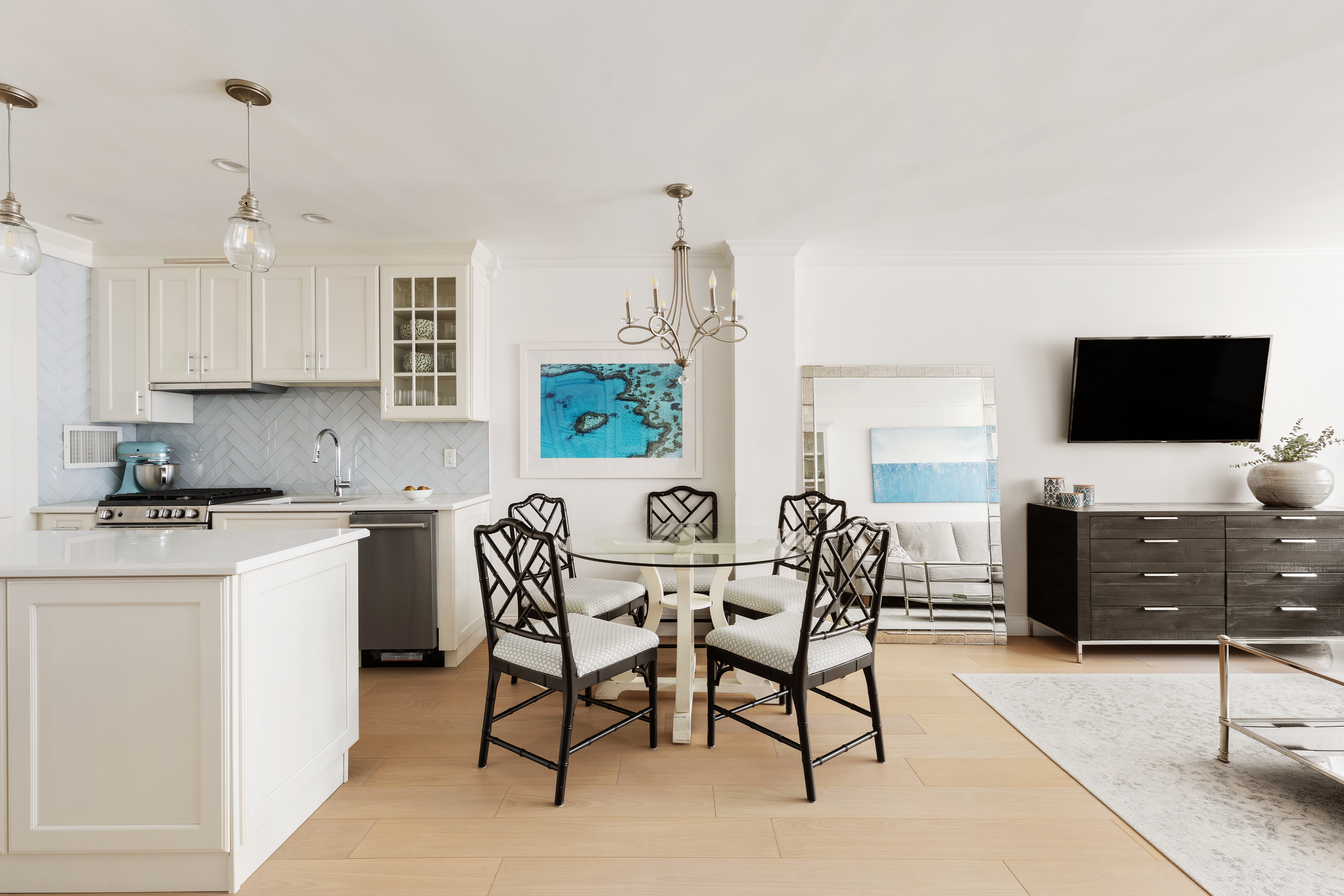 a dining room with furniture a window and a flat screen tv