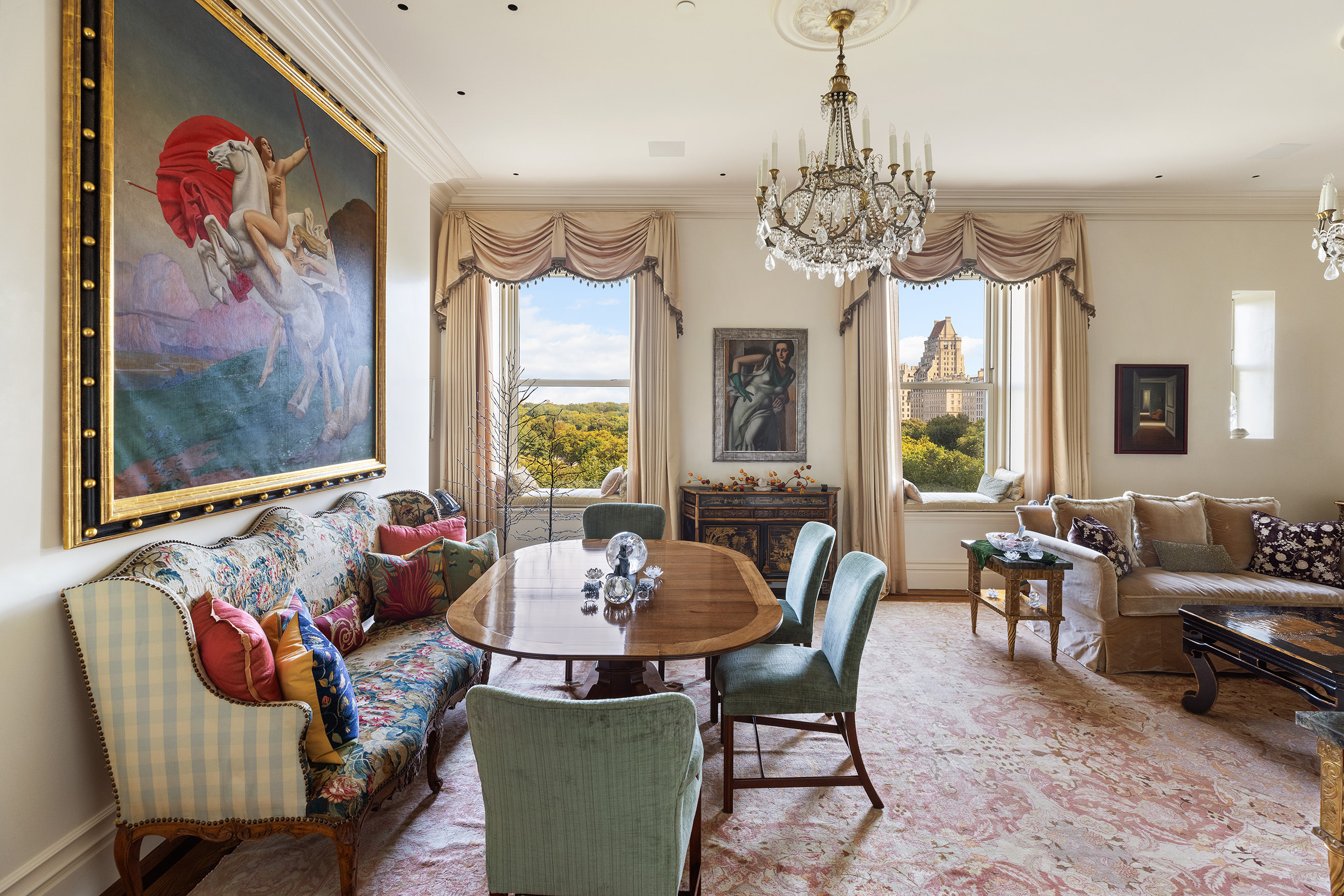 a dining room with furniture a chandelier and window