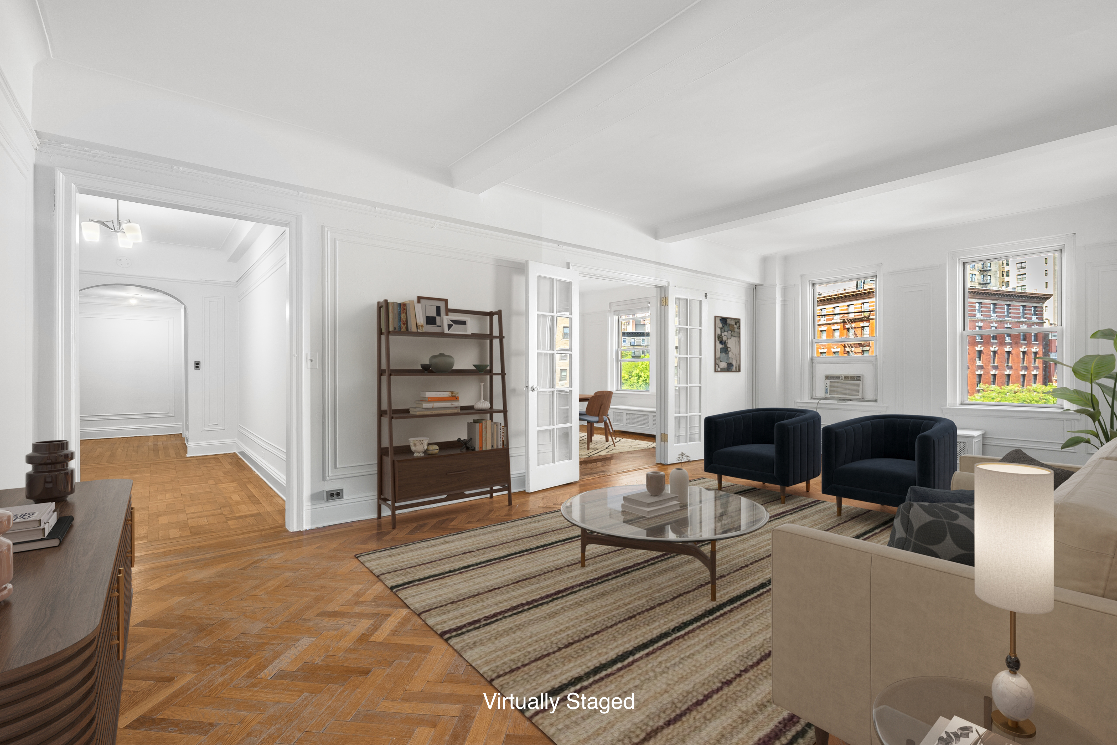 a living room with furniture a view and wooden floor