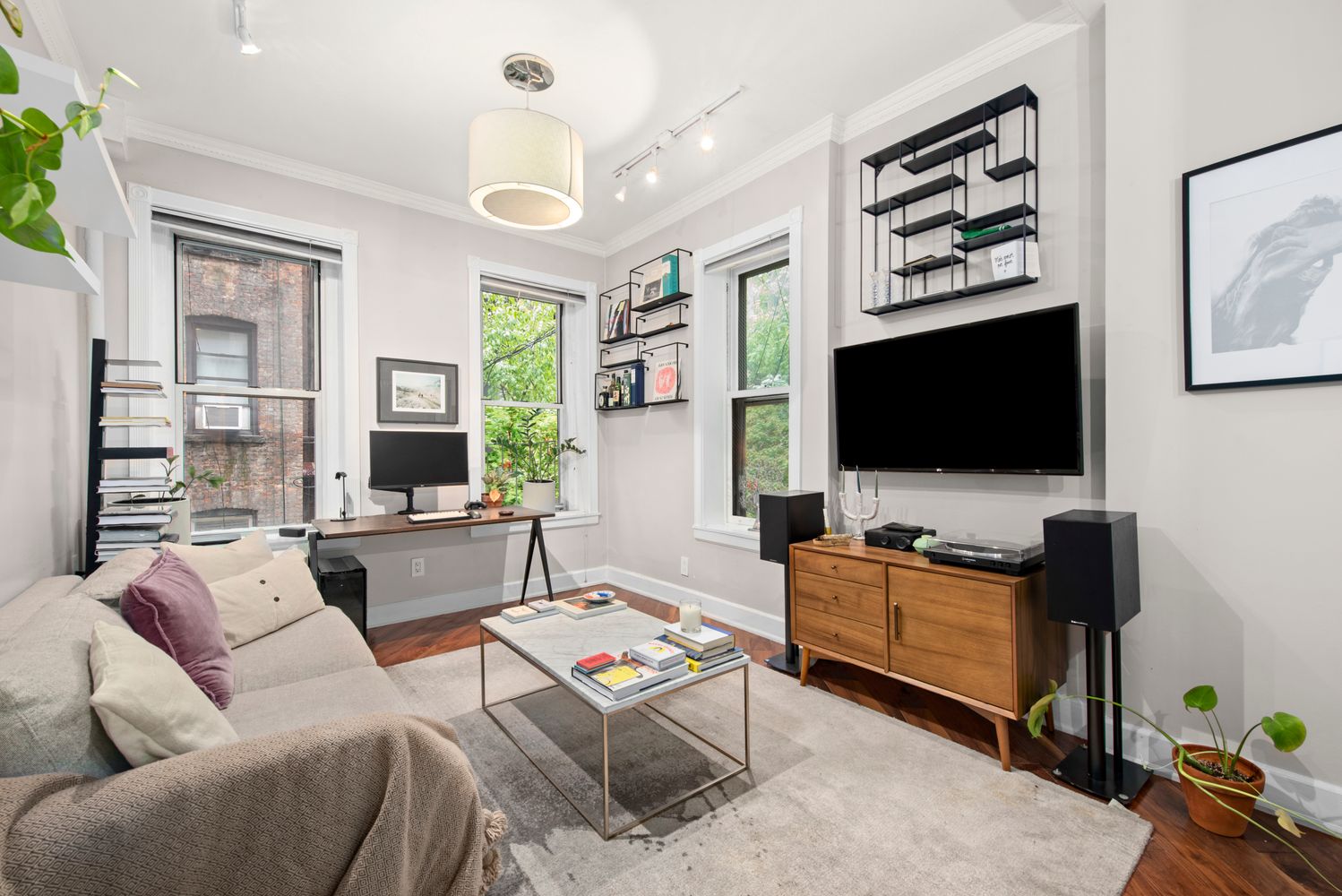 a living room with furniture and a flat screen tv