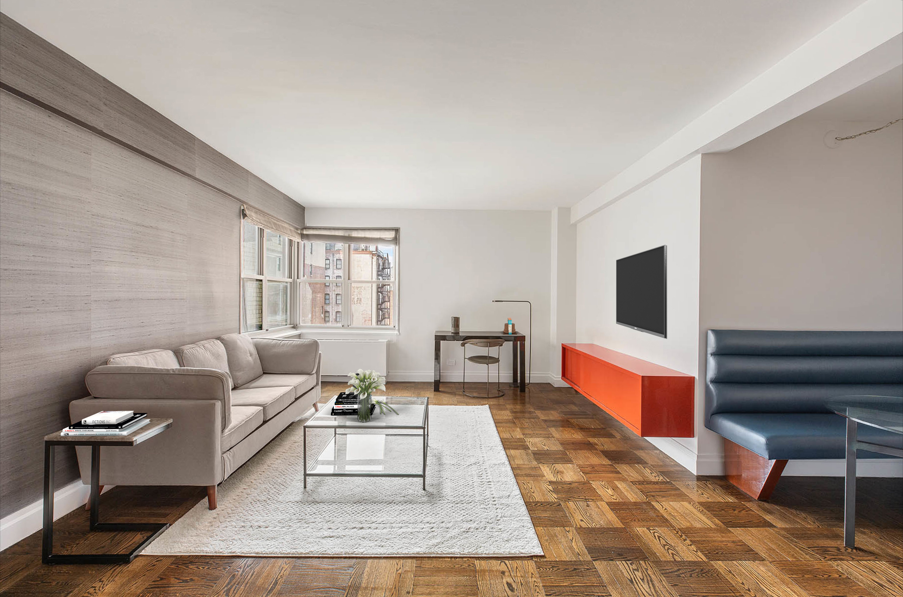 a living room with furniture a flat screen tv and a rug