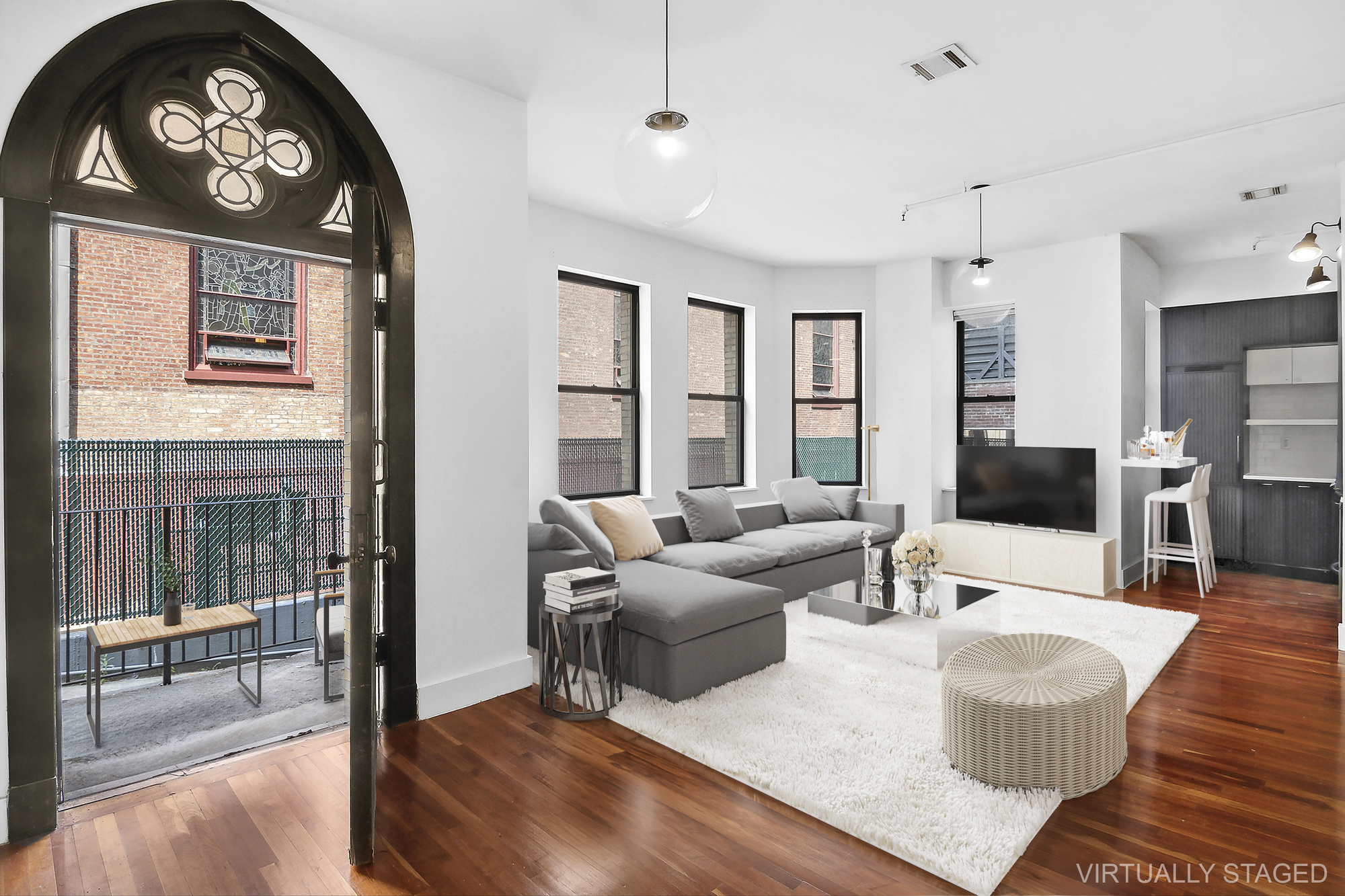 a living room with furniture and a large window