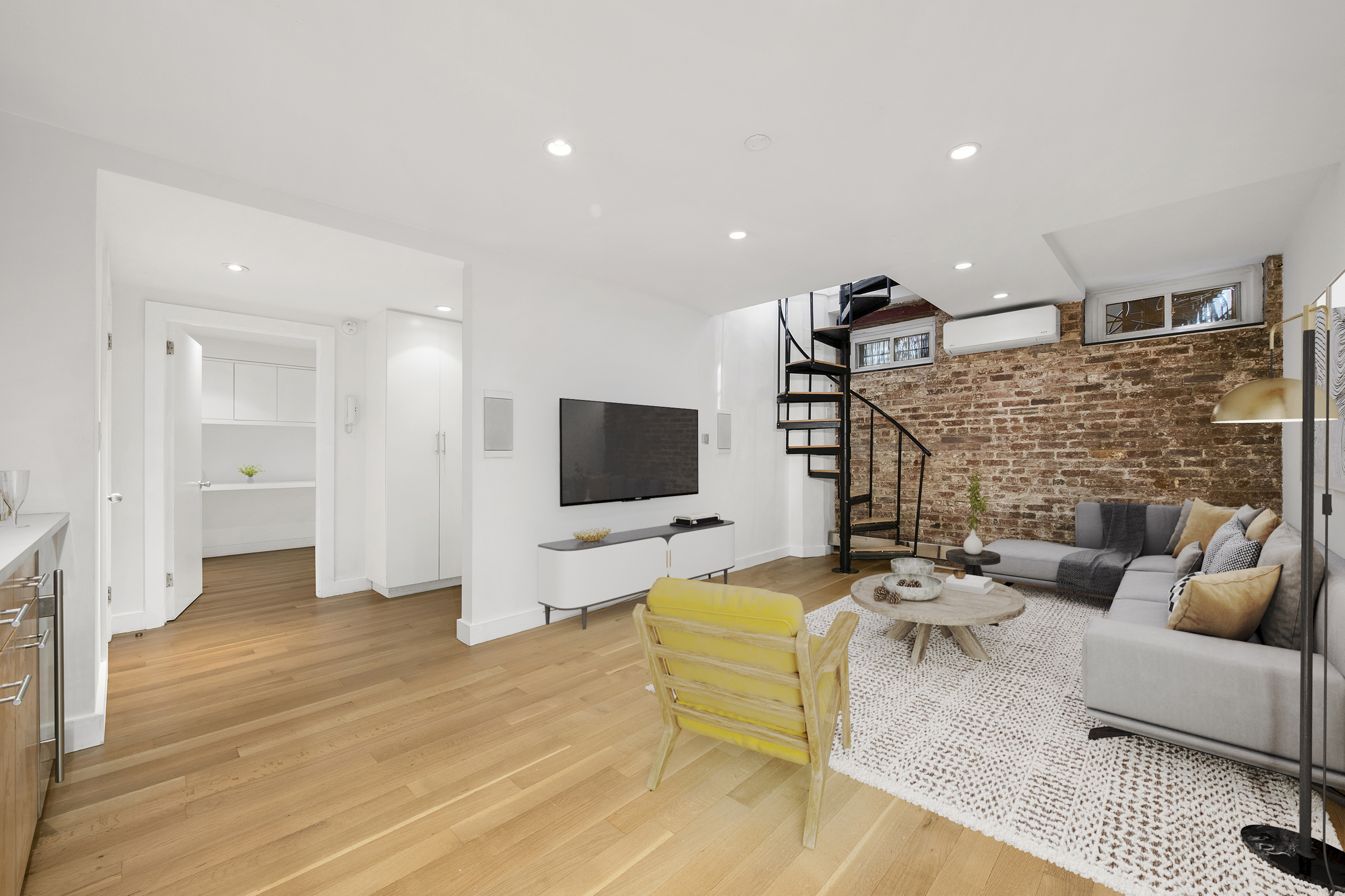 a living room with fireplace furniture and a flat screen tv