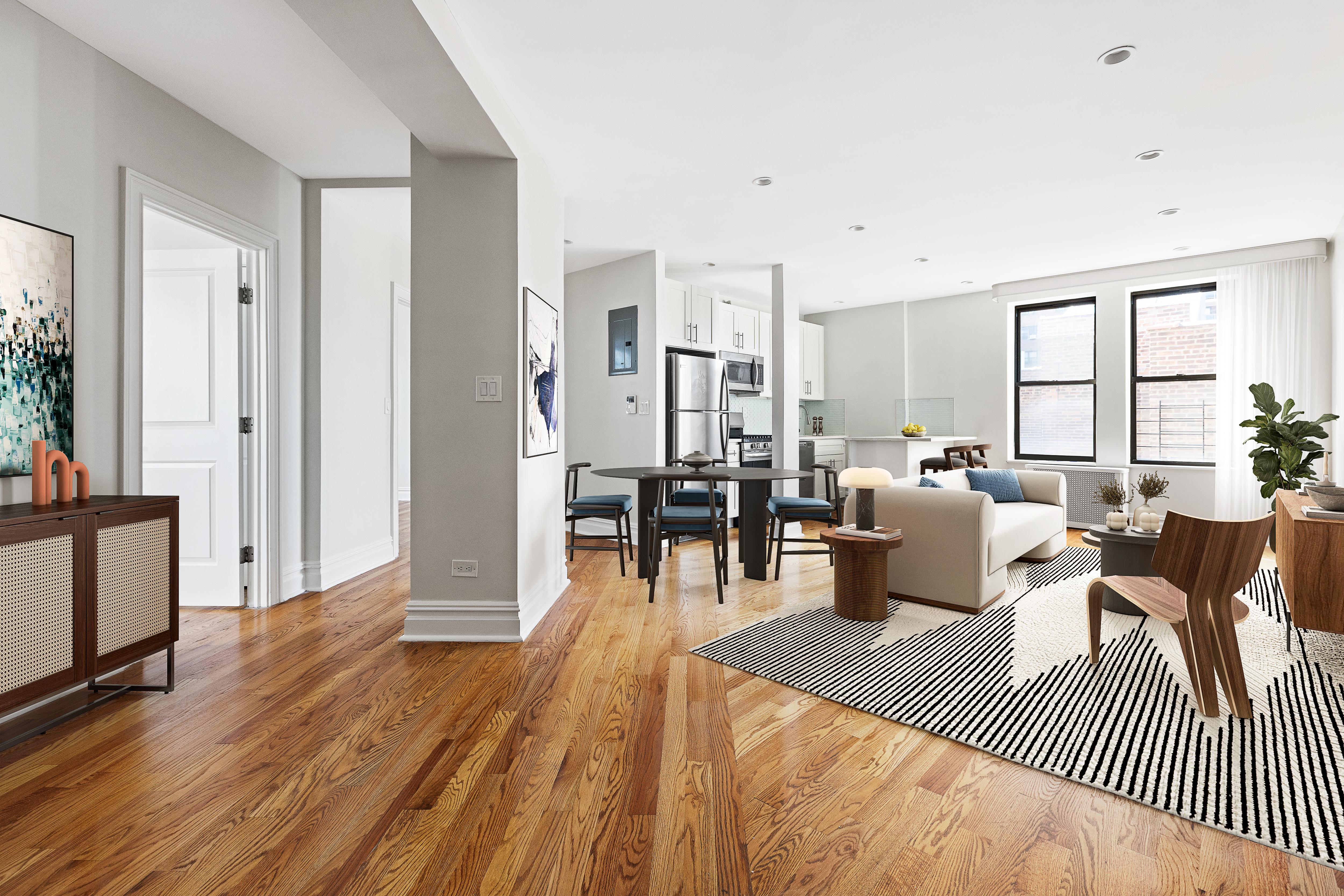 a living room with furniture a wooden floor