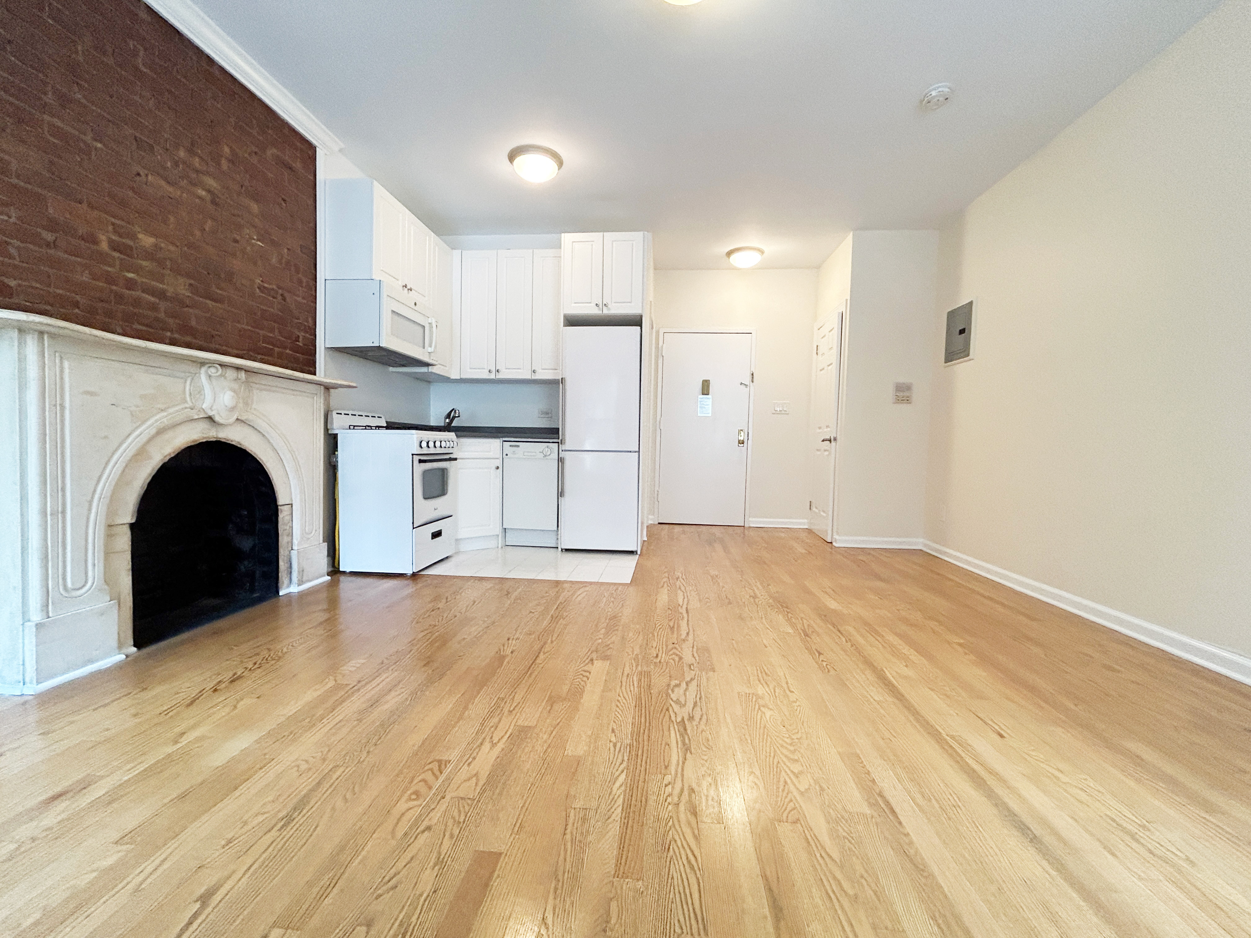 a view of kitchen with sink and cabinets