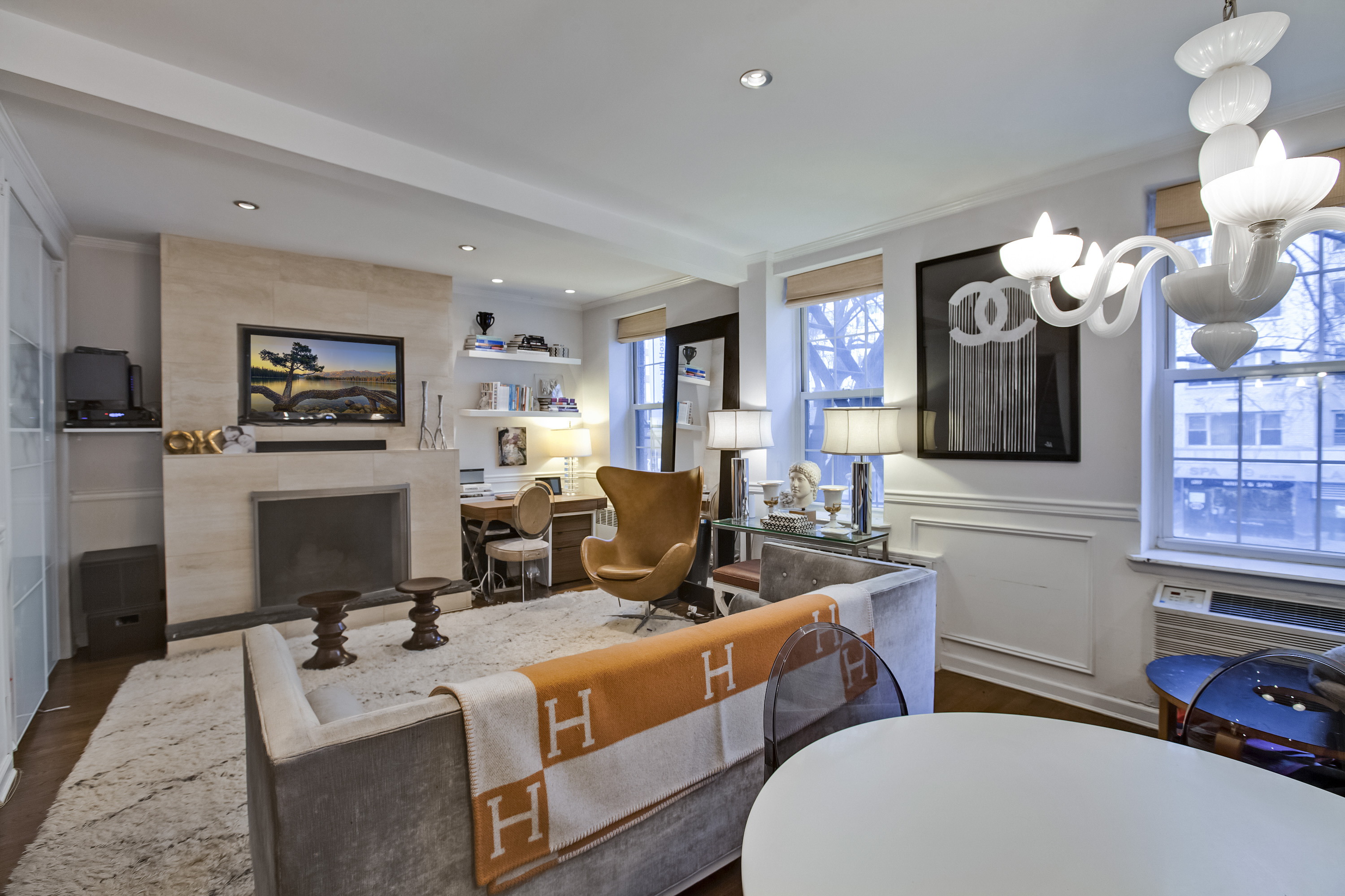 a living room with furniture and a flat screen tv