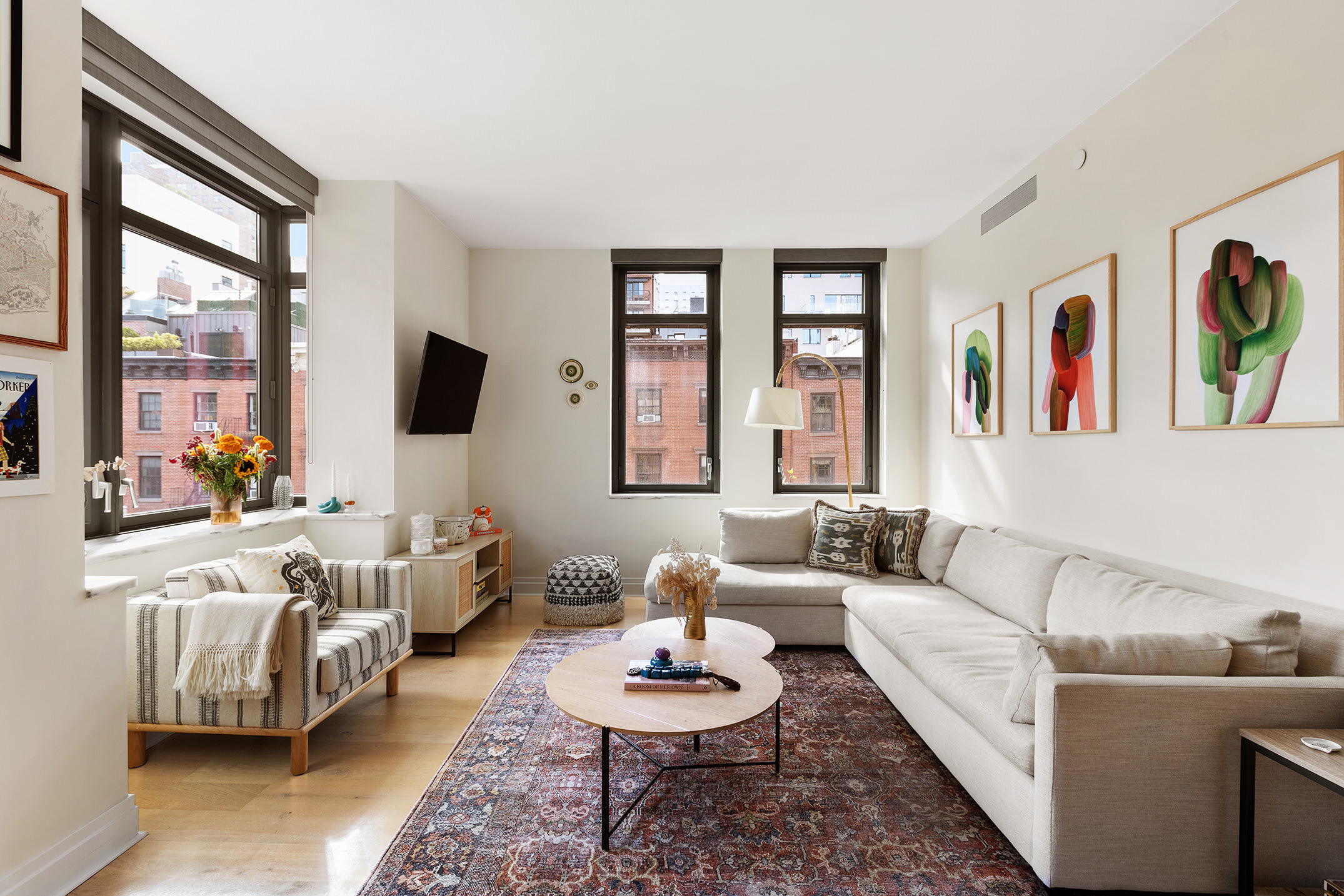 a living room with furniture and a flat screen tv