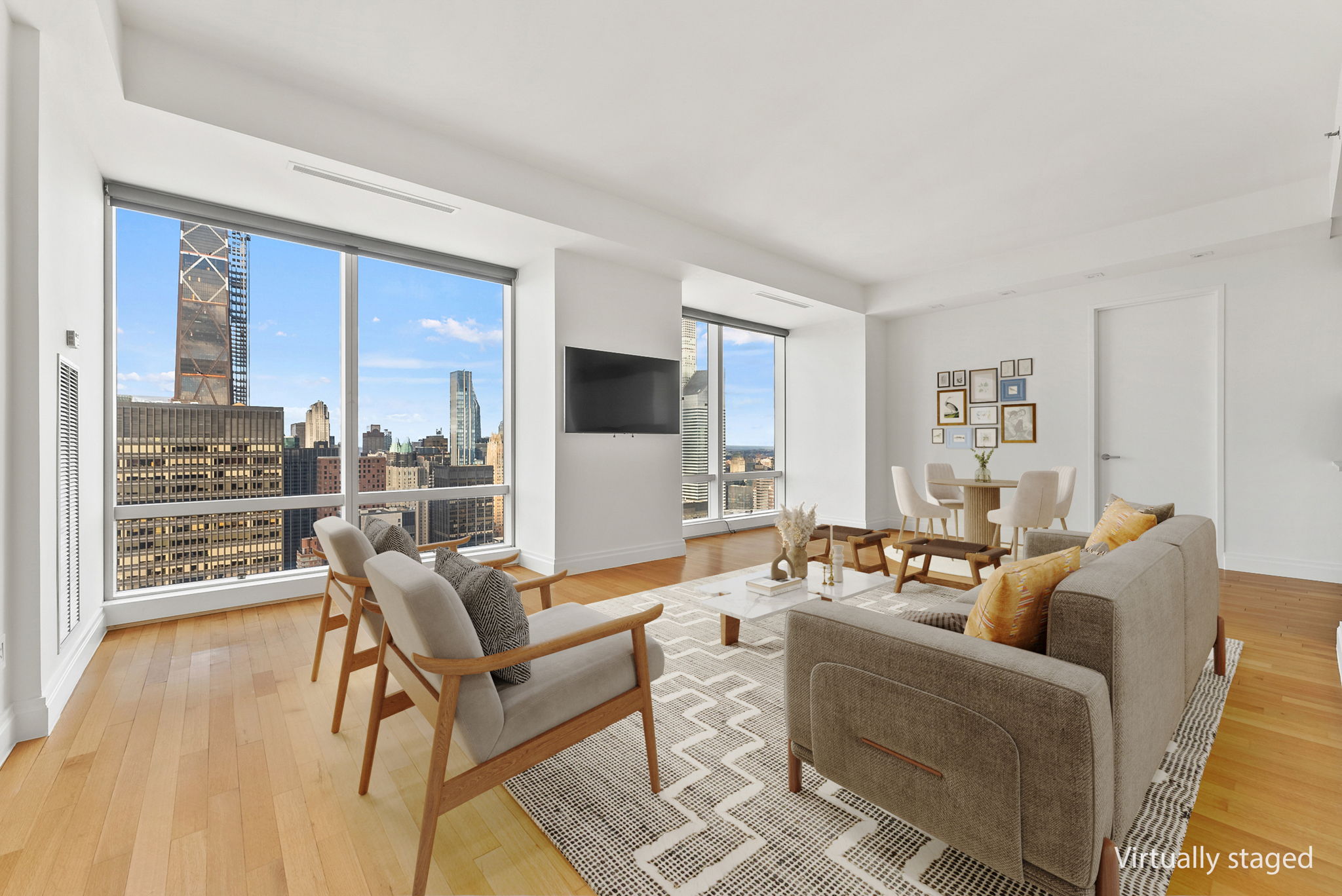 a living room with furniture and a floor to ceiling window