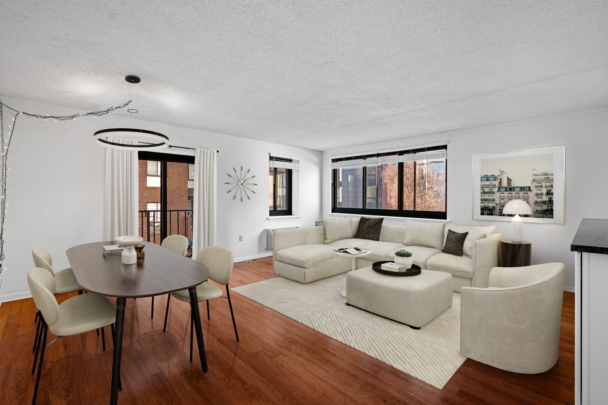 a living room with furniture and a wooden floor