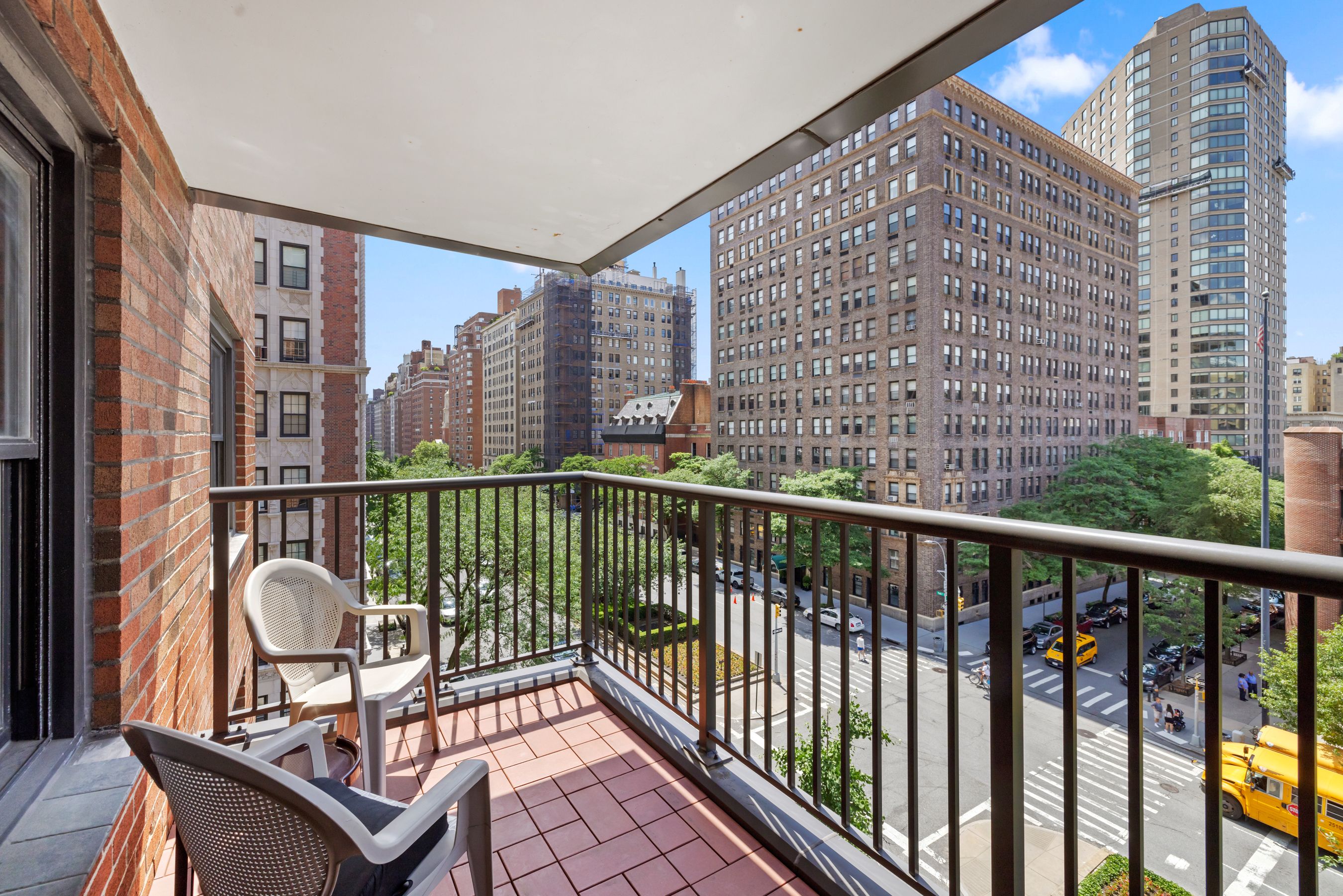 a view of a balcony with wooden floor