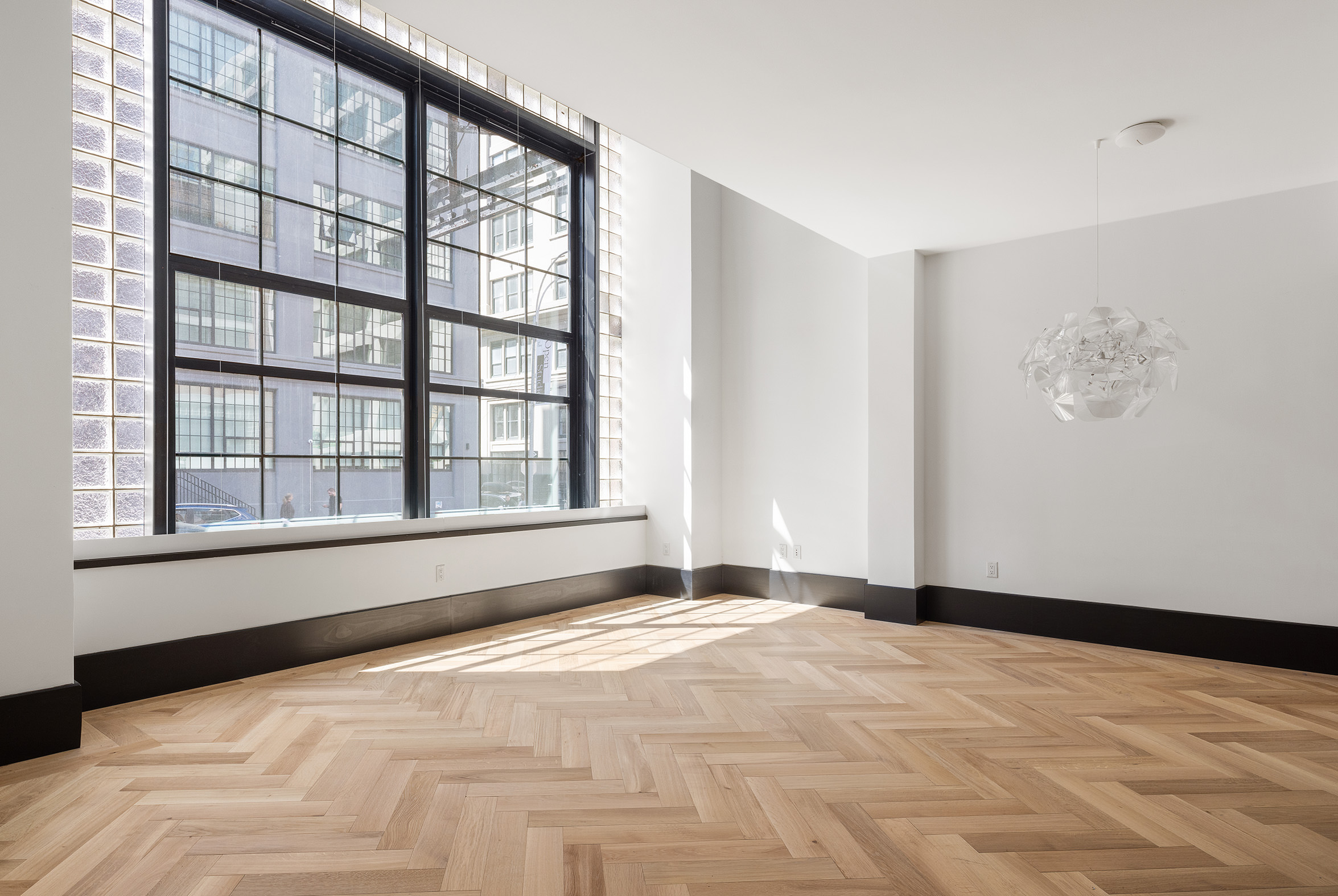 a view of an empty room with a window