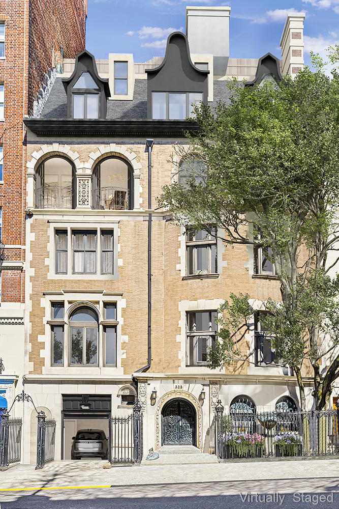 a front view of a residential apartment building with a yard