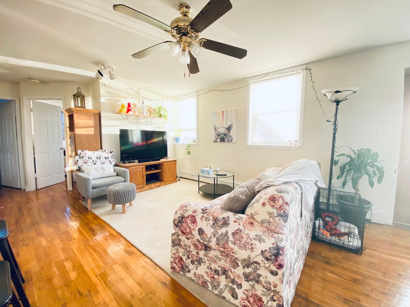 a living room with furniture and a flat screen tv