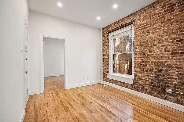 a view of a livingroom with wooden floor