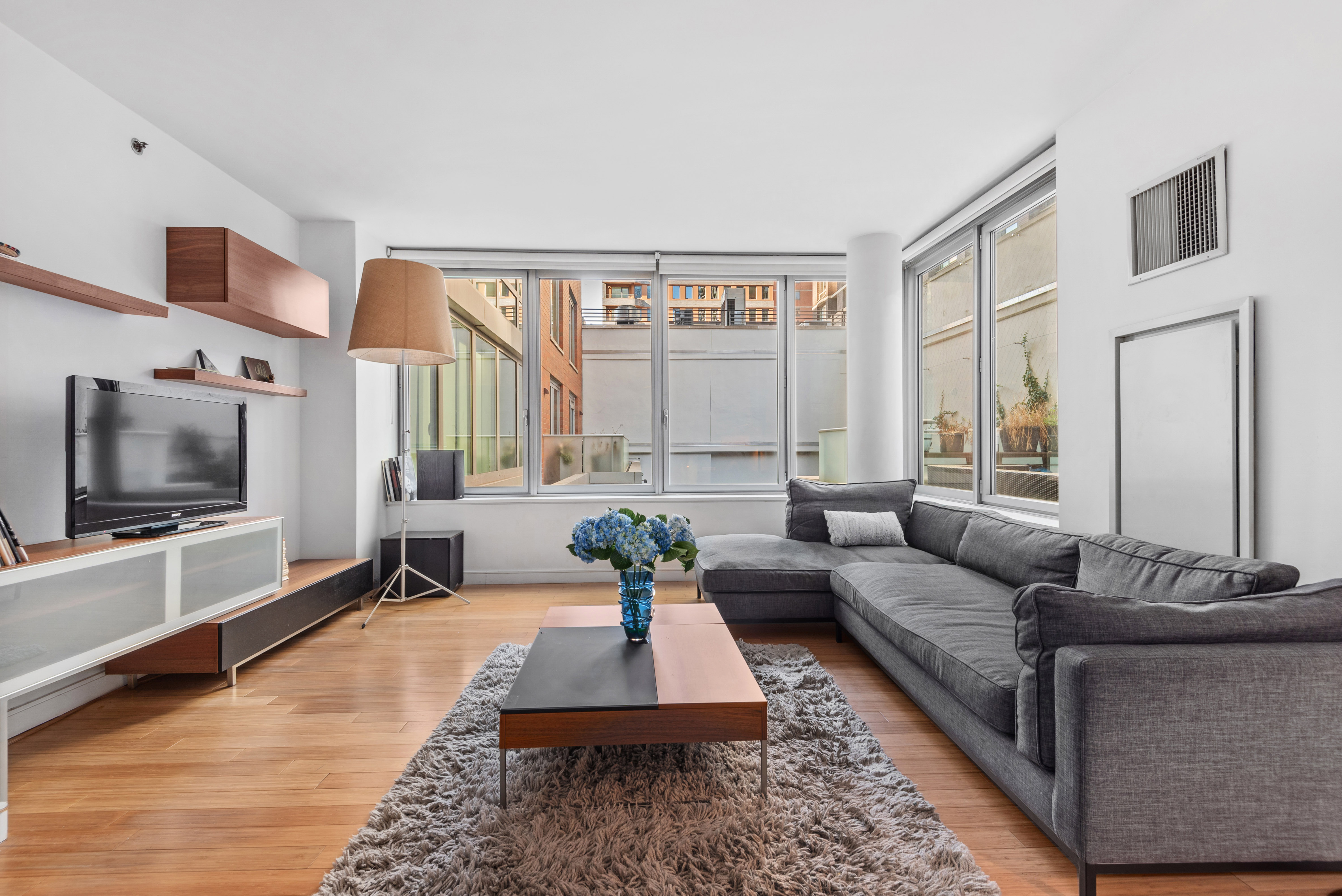 a living room with furniture and a flat screen tv