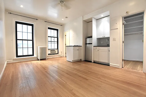 a view of a kitchen with a stove cabinets and wooden floor